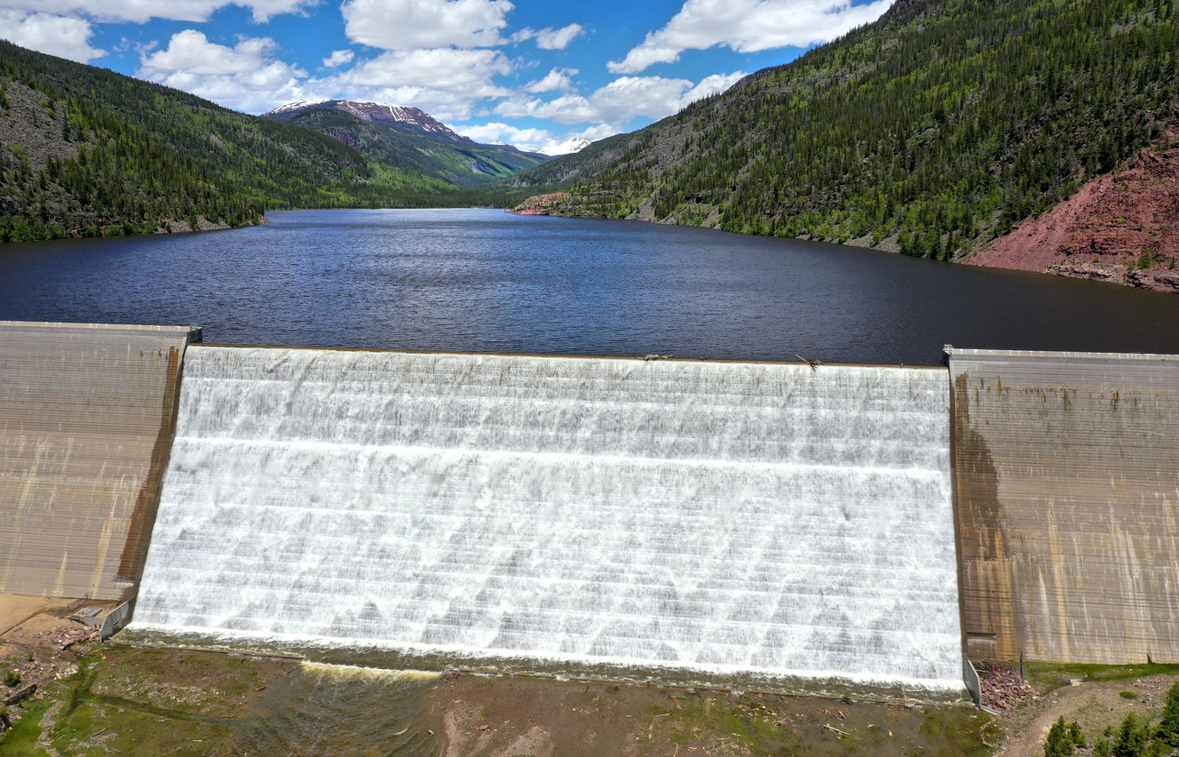 A curtain of water flows over the Upper Stillwater Reservoir Dam, which is an hour’s drive northwest of Duchesne in Rock Creek Canyon, on Monday, June 24, 2019. The reservoir is at 100% capacity and water is flowing over the 200-foot tall spillway, which measures about 600 feet across. Niagara Falls has a 160-foot vertical drop. (Photo: Steve Griffin, KSL)