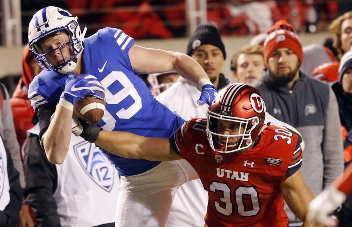 BYU tight end Matt Bushman, rear, makes a reception against Utah Utes linebacker Cody Barton (30) in the second half during an NCAA college football game Saturday Nov. 24, 2018, in Salt Lake City. (Photo: Rick Bowmer, AP)
