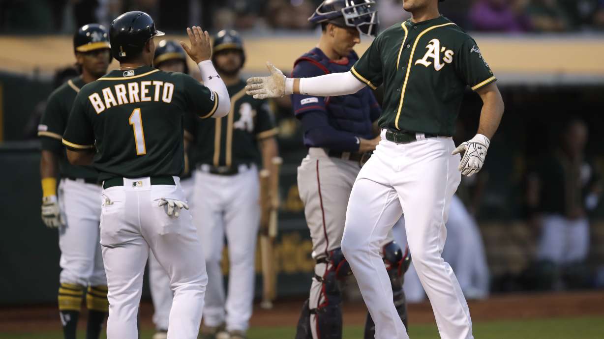 Herrmann grand debut leads Athletics past Twins 8-6