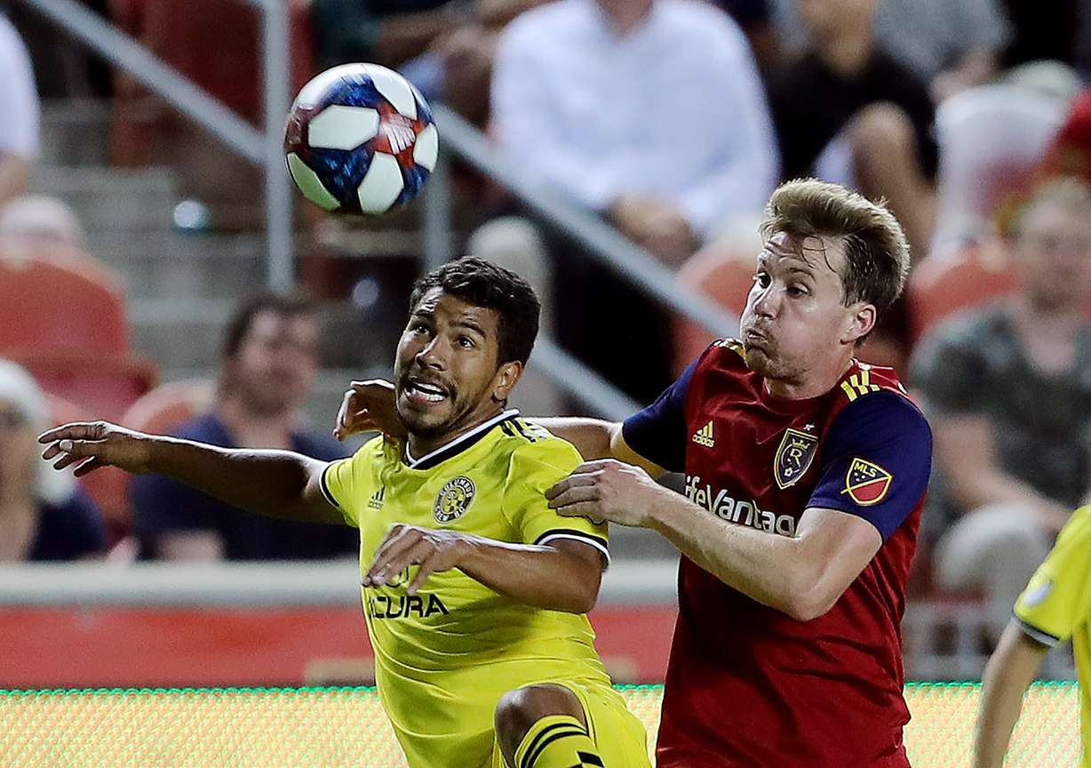 Columbus Crew midfielder Eduardo Sosa (20) and Real Salt Lake midfielder Nick Besler (13) work to get at the ball as Real Salt Lake and Columbus Crew play a Major League Soccer game at Rio Tinto Stadium in Sandy on Wednesday, July 3, 2019. RSL won 1-0. (Photo: Scott G Winterton, KSL)