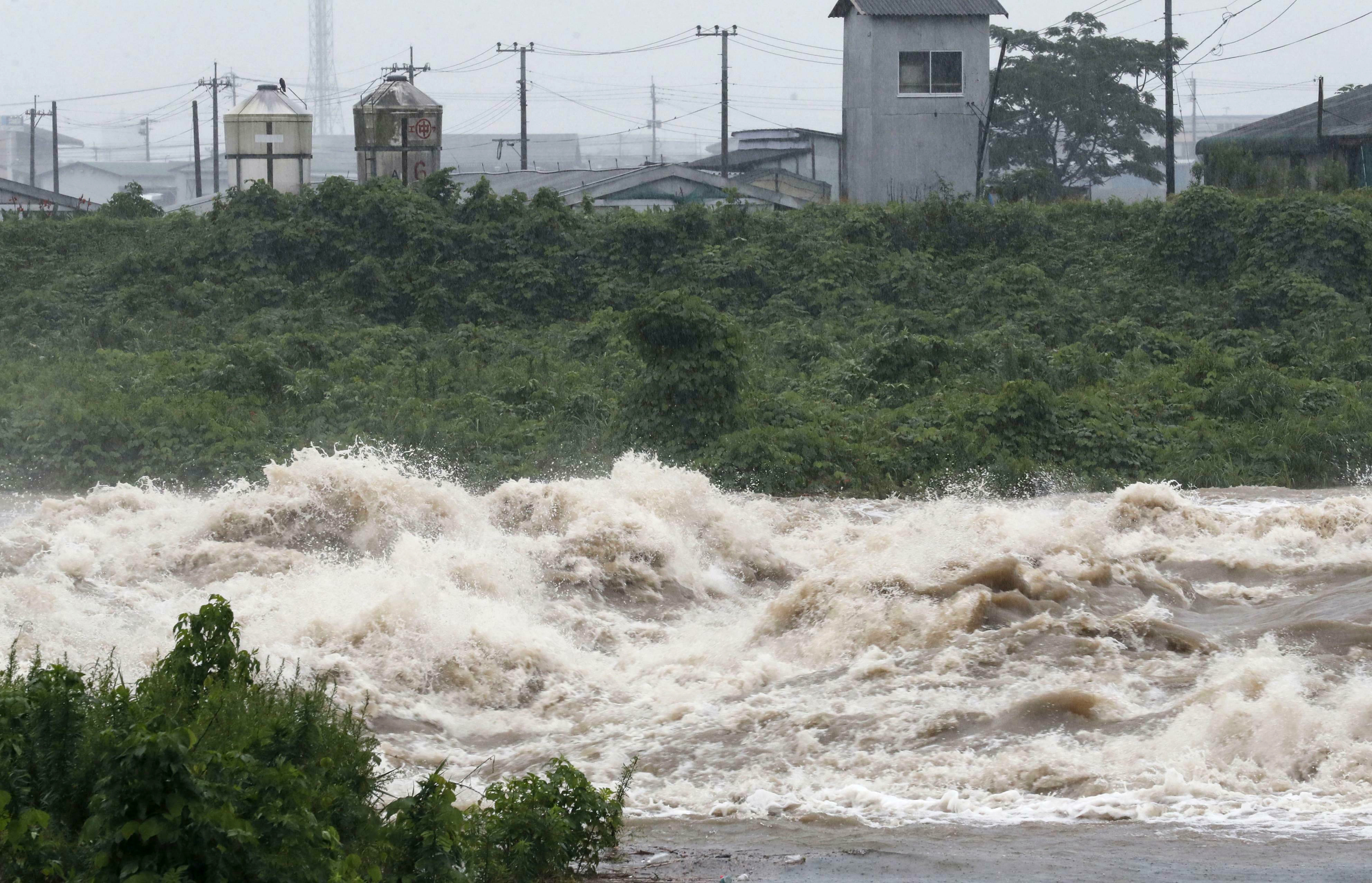 Heavy rain in south Japan causes floods, mudslides, blackout