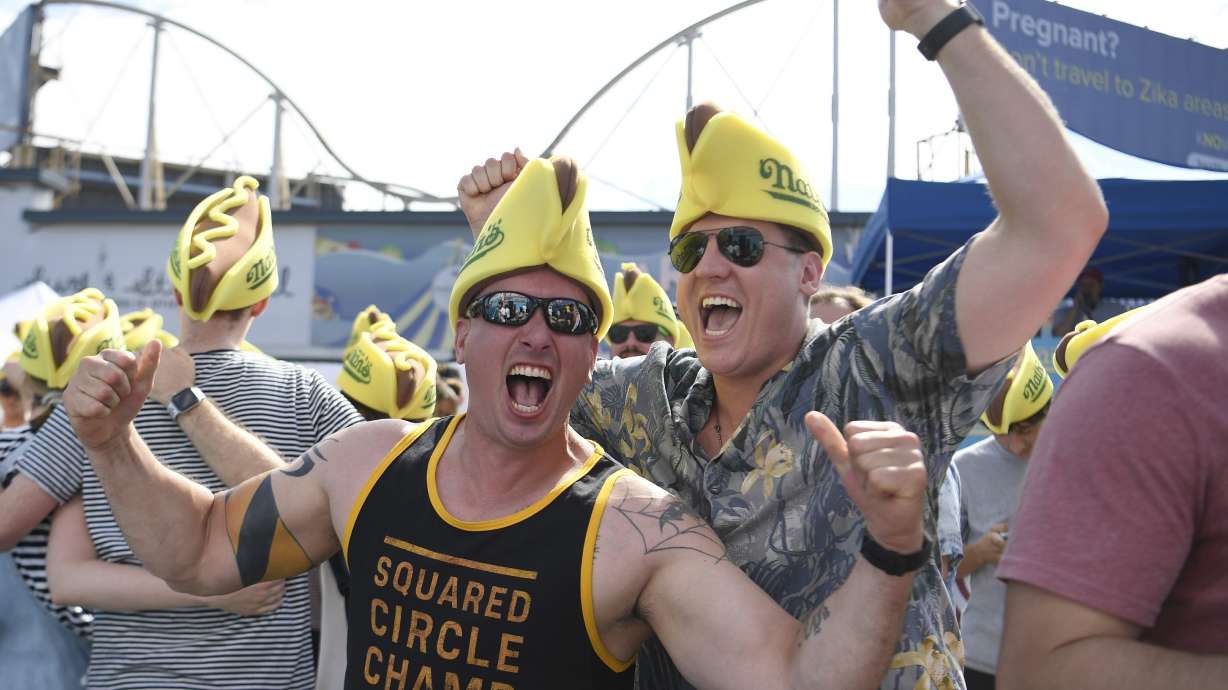 The Latest: Joey 'Jaws' Chestnut eats 71 hot dogs to win