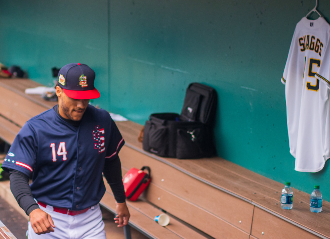 Salt Lake Bees outfielder Michael Hermosillo walks past a Tyler Skaggs jersey before a game at Smith's Ballpark on Thursday, July 4, 2019. Skaggs, who died on Monday, pitched for the Bees in 2014, 2016 and 2017. (Photo: Carter Williams, KSL.com)