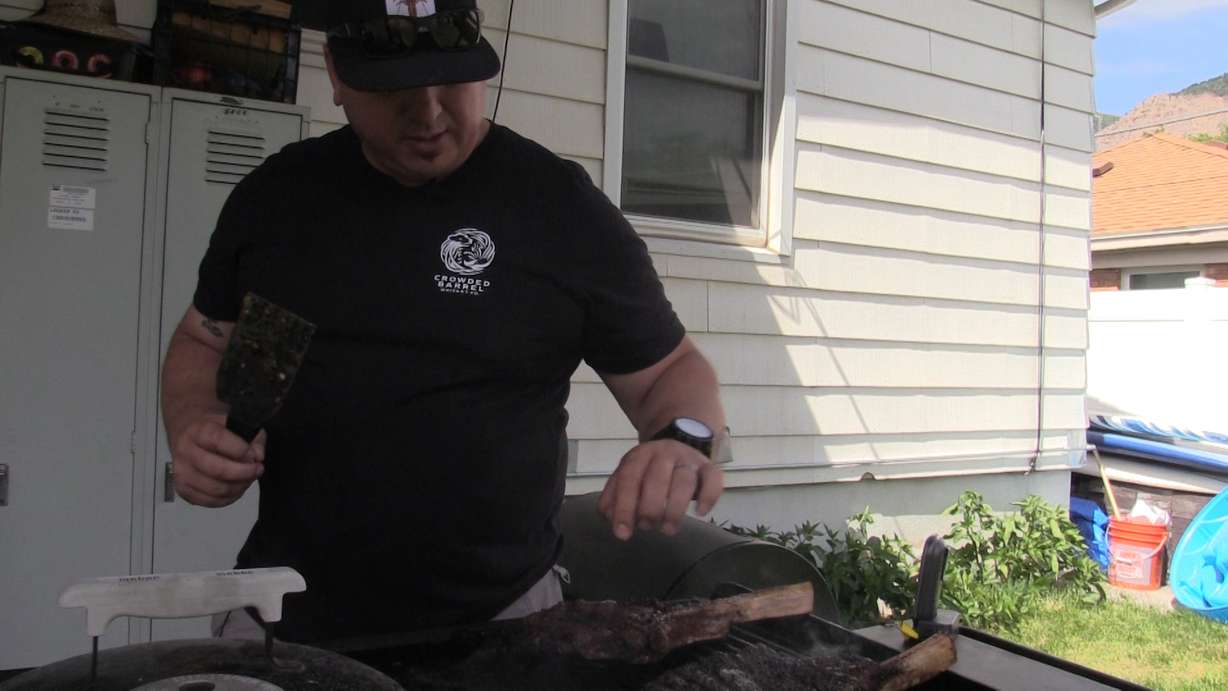 Backyard griller Julius Vasquez grills up a couple of tomahawk steaks. Photo: KSL TV