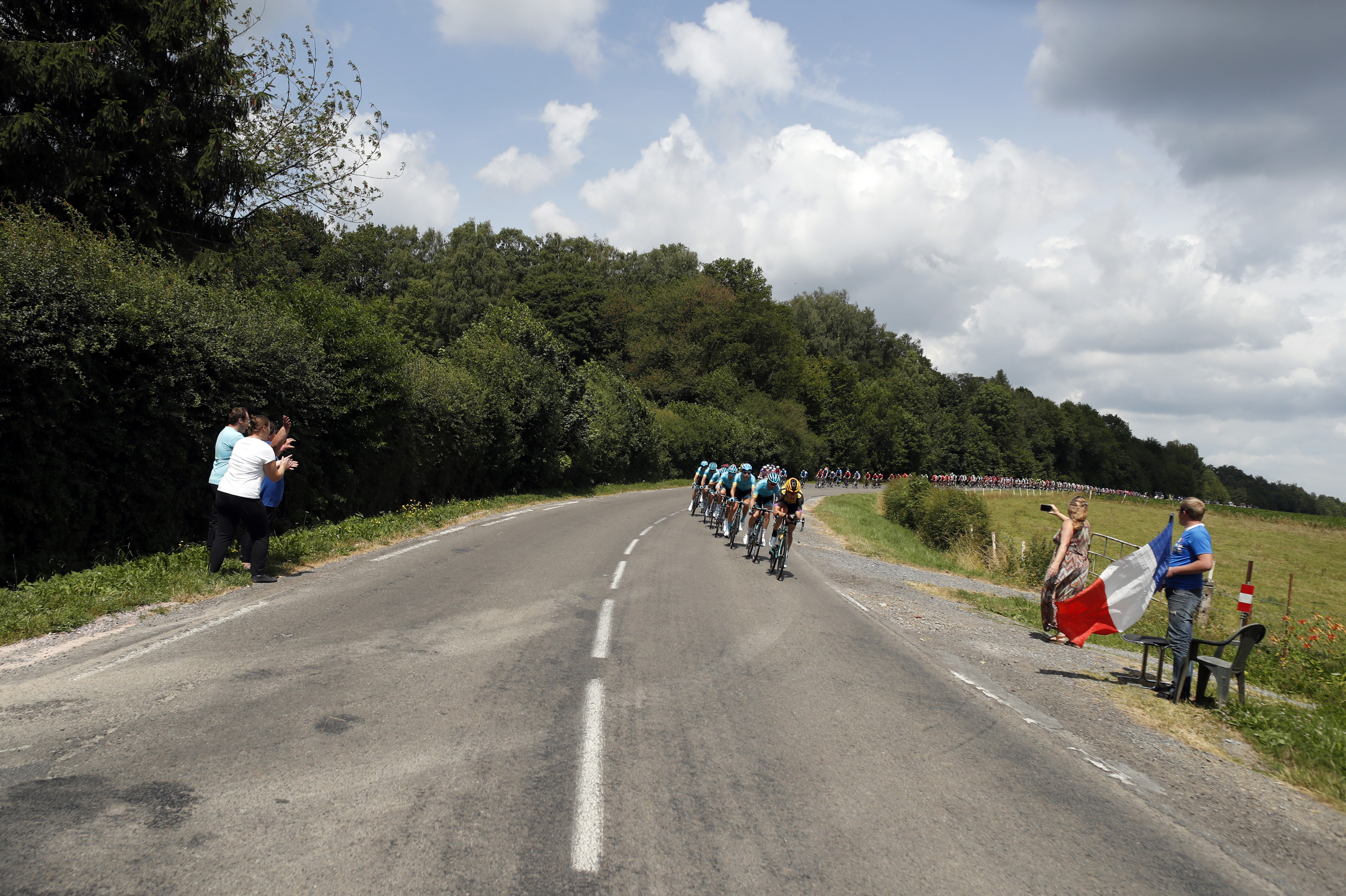 Working class pride and bubbly on the Tour de France route