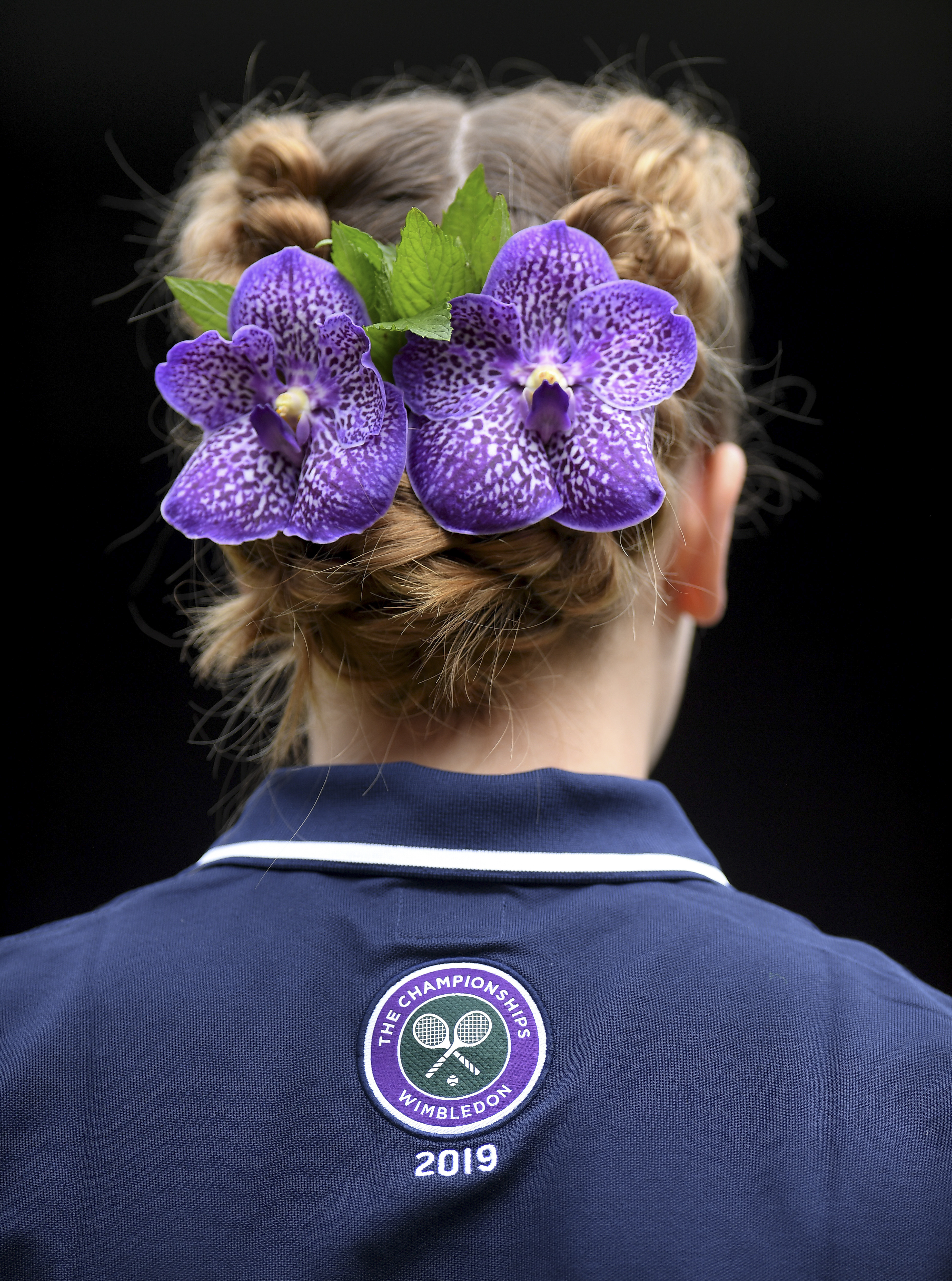 The Latest: Djokovic beats Federer in Wimbledon final