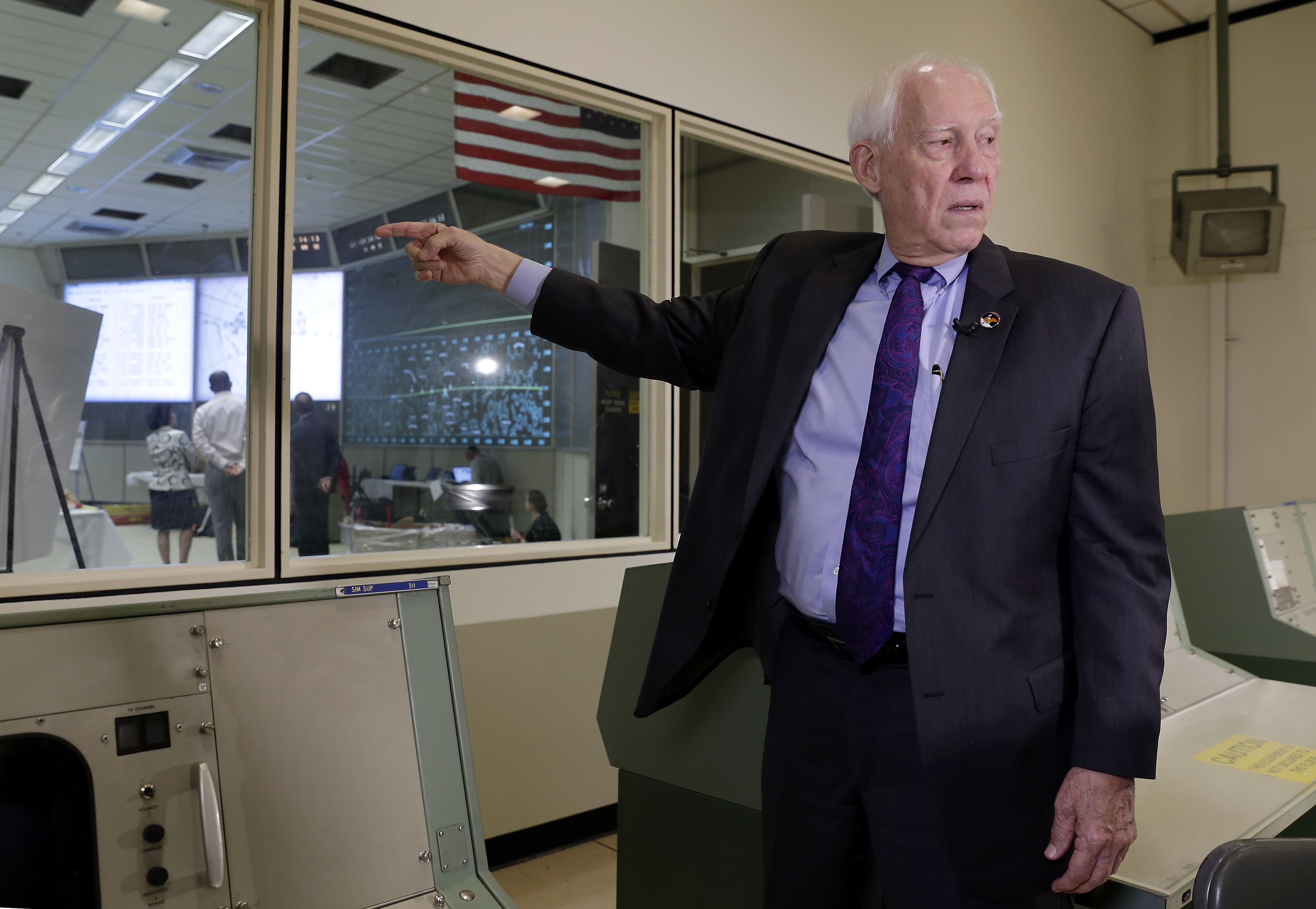 In this Monday, June 17, 2019 photo, Spencer Gardner, a flight activities officer during the Apollo missions, speaks during an interview inside the simulation room next to the mission control room which is under restoration at NASA's Johnson Space Center in Houston. Looking back, Gardner wishes he'd savored the moment of touchdown more. But he had a job to do and there was no time for reflection. (Michael Wyke, AP Photo)