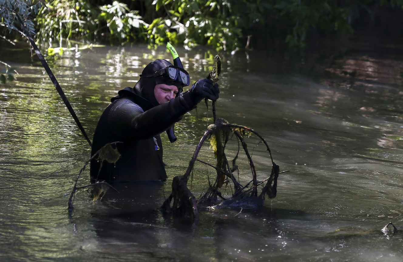 A member of law enforcement searches the Jordan River for evidence in the Mackenzie Lueck case at Riverside Park in Salt Lake City on Monday, July 15, 2019. (Photo: Colter Peterson, KSL)