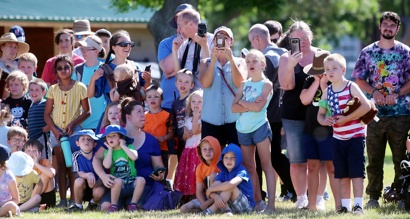 Kids and their parents watch as a model rocket prepares to lift off from Veterans Memorial Park in West Jordan on Tuesday, July 16, 2019, during a worldwide celebration of the 50th anniversary of the Apollo 11 mission. (Photo: Scott G Winterton, KSL)
