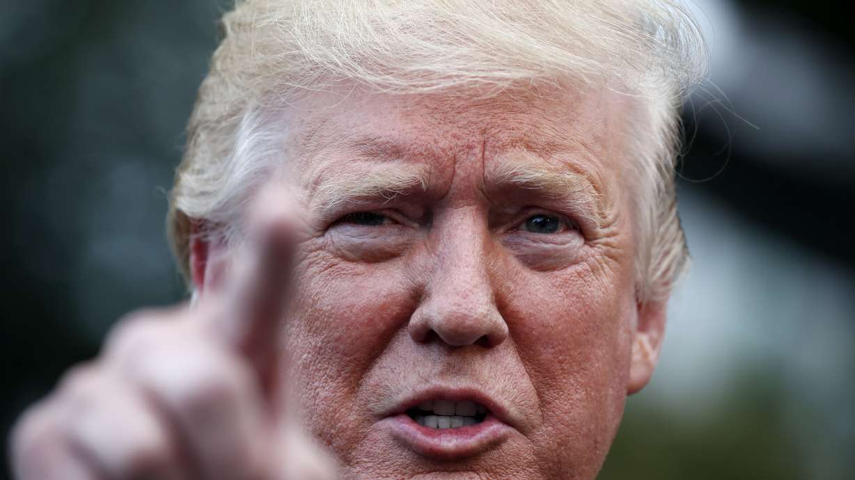 The Latest: Trump claims he was 'not happy' with chant