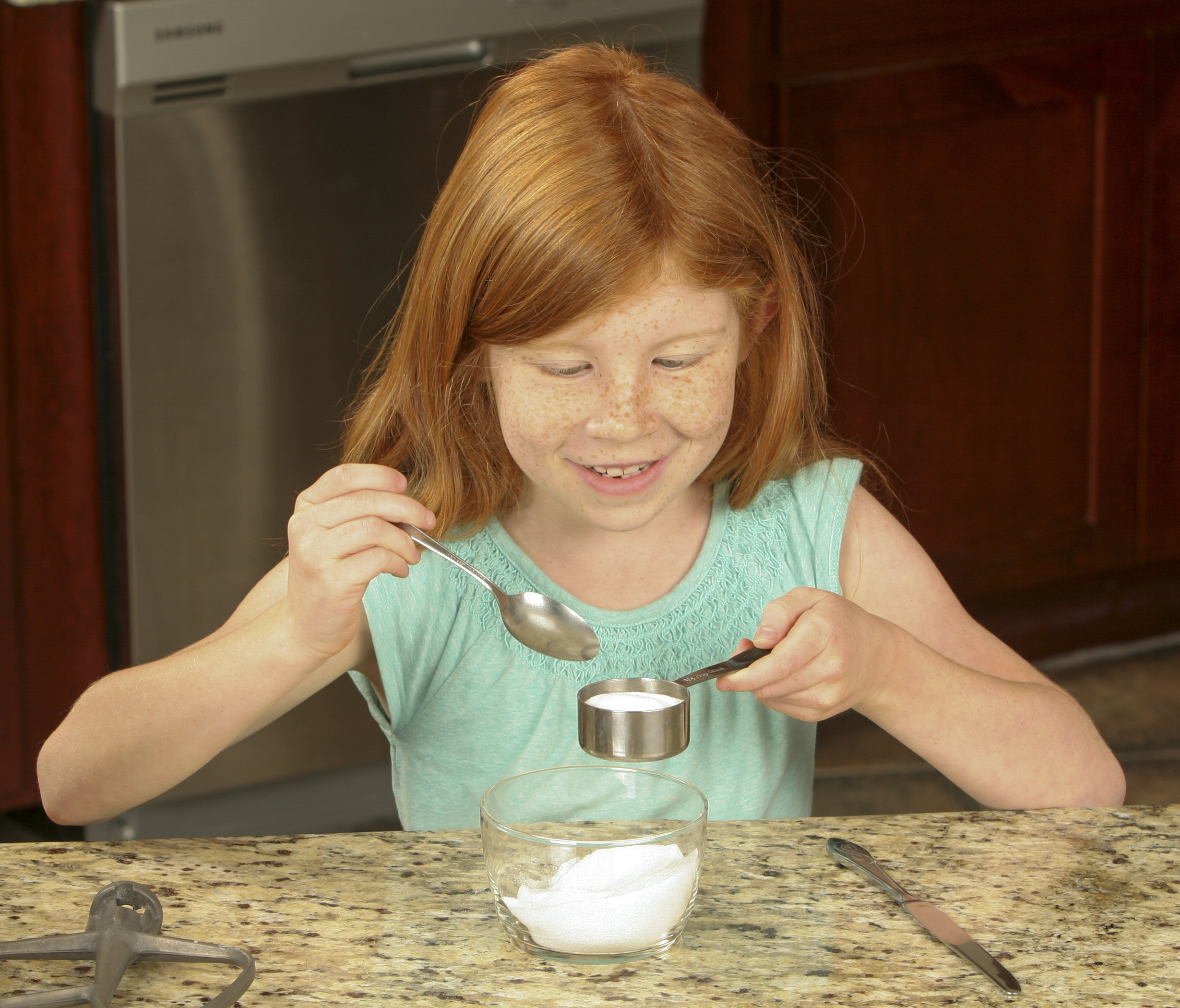 To fight summer learning loss, encourage kids to use their math skills in real life by figuring out how to double or halve recipes. (Photo: Collin Quinn Lomax, Shutterstock)