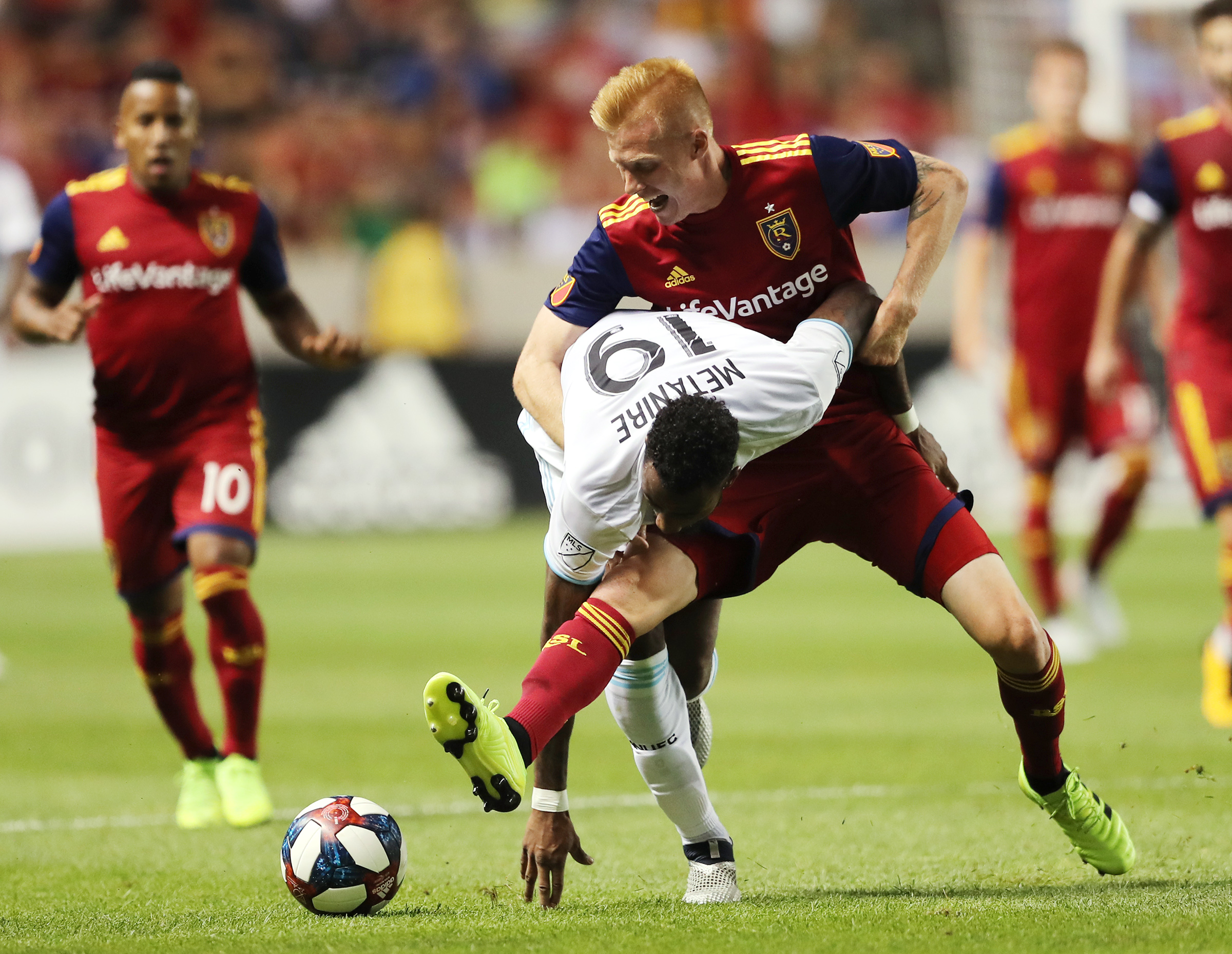 Real Salt Lake defender Justen Glad (15) battles Minnesota United defender Romain Metanire (19) for the ball as Real Salt Lake and Minnesota play in an MLS soccer match at Rio Tinto Stadium in Sandy on Saturday, July 20, 2019. The two teams played to a 1-1 draw. (Photo: Scott G Winterton, KSL)