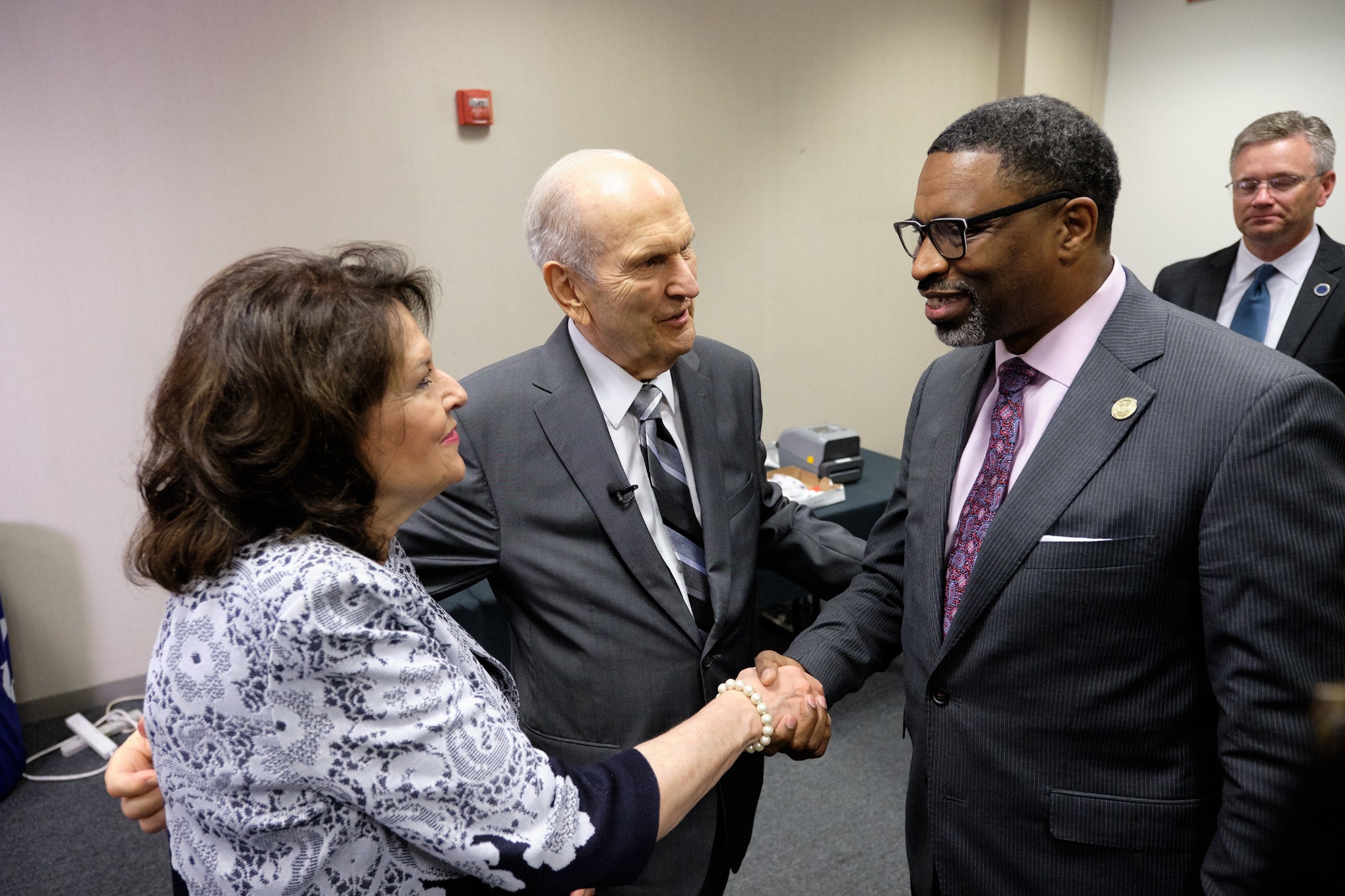 President Russell M. Nelson and his wife, Wendy, are greeted by NAACP President and CEO Derrick Johnson at the NAACP's 110th annual national convention in Detroit on July 21, 2019. (Photo: Intellectual Reserve)