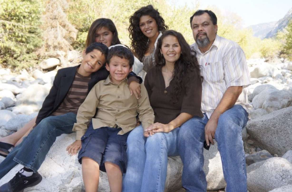 Gustavo Vega, right, poses with family members for a portrait. (Photo: Family photo)