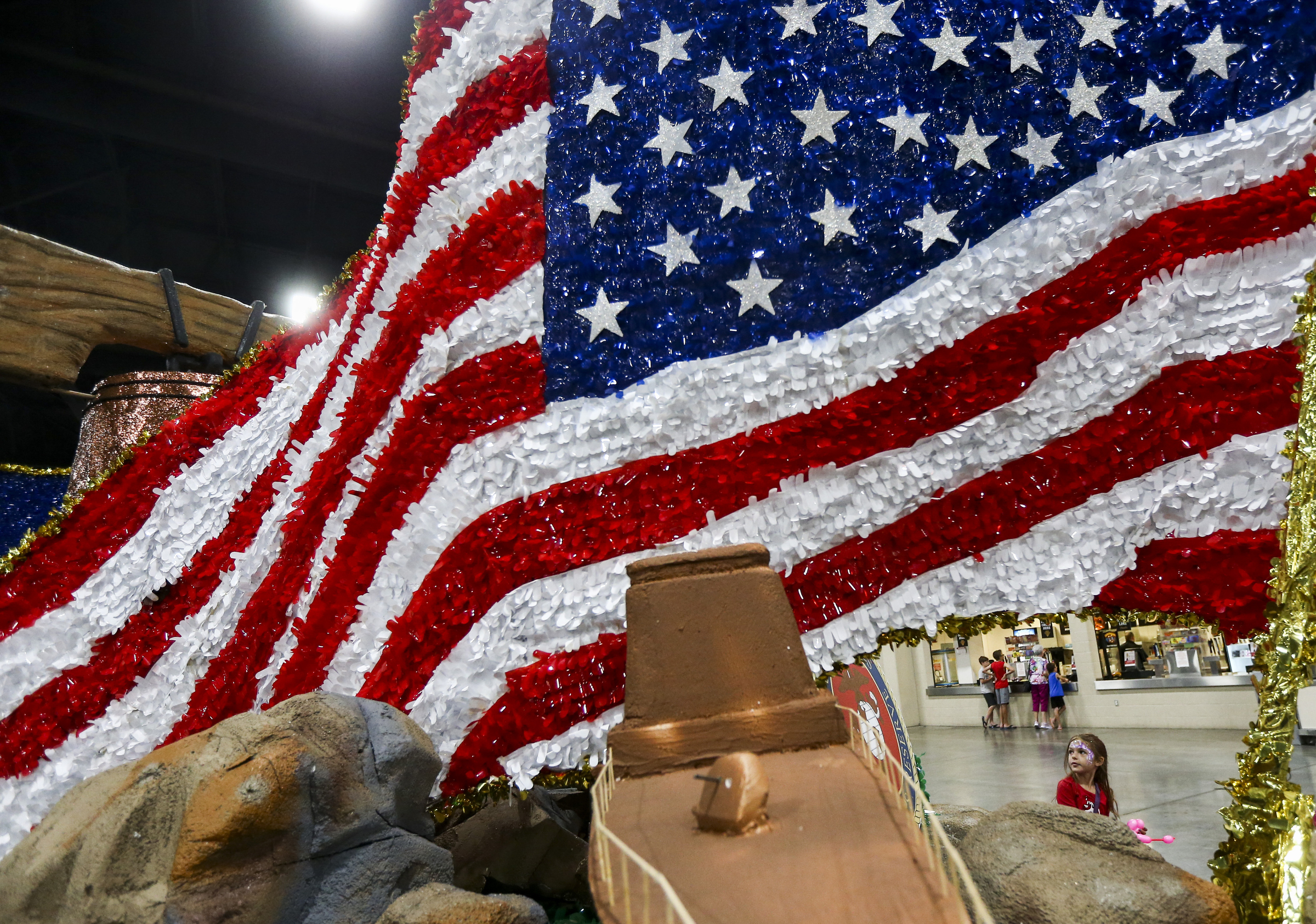 Aria Thomas, 5, checks out the City of Cottonwood Heights float during the Days of 47 Float Preview at the Mountain America Expo Center in Sandy on Monday, July 22, 2019. Float makers put their floats on display Monday and Tuesday for the community to get up close before the parade. (Photo: Colter Peterson, KSL.)