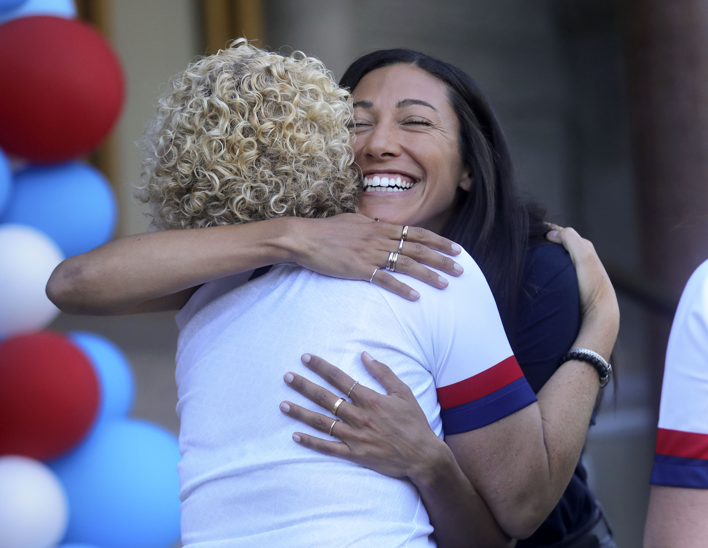Salt Lake City Mayor Jackie Biskupski hugs United States women's national soccer team forward Christen Press before giving her the keys to the city outside of the City and County Building in Salt Lake City on Monday, July 22, 2019. (Photo: Kristin Murphy, KSL)