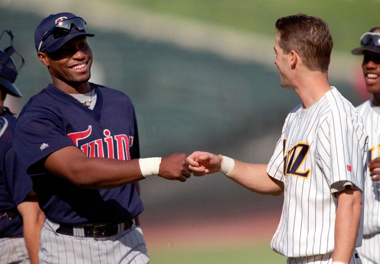 Minnesota Twins outfielder Torii Hunter and Buzzman Dan Cey congratulate each other after the game Thursday, May 13, 1999. (Photo: Chuck Wing, KSL, File)