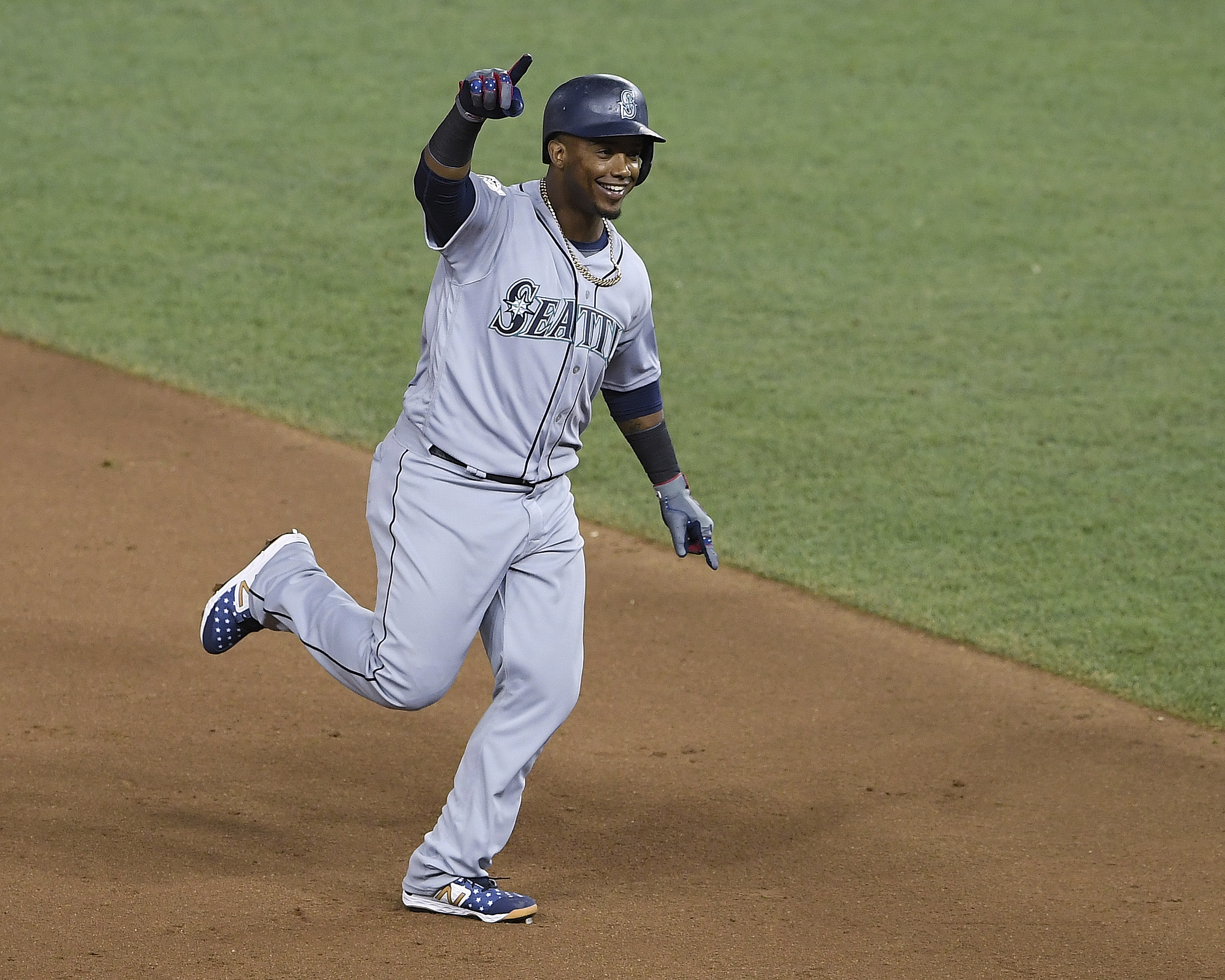 Seattle Mariners Jean Segura (2) points the bench as he rounds the bases on a three-run homer in the eighth inning during the Major League Baseball All-star Game, Tuesday, July 17, 2018 in Washington. (Nick Wass, AP Photo, File)