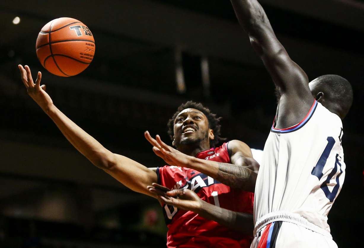Team Utah small forward Terrence Drisdom (1) shoots around Eberlein Drive power forward Pape Malik Dime during the third quarter of game one in The Basketball Tournament at the Maverick Center in West Valley City on Thursday, July 25, 2019. (Photo: Colter Peterson, Deseret News)