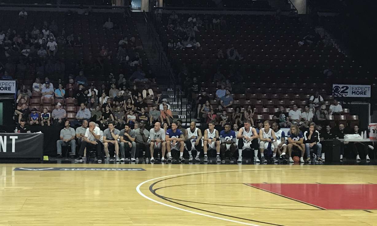 Jimmer Fredette sits next to former BYU coach Dave Rose, far left, during an opening round game of The Basketball Tournament. Fredette, who will play in Greece next year, was an assistant coach to Rose with Team Fredette in TBT's Salt Lake regional. (Photo: Sean Walker, KSL.com)