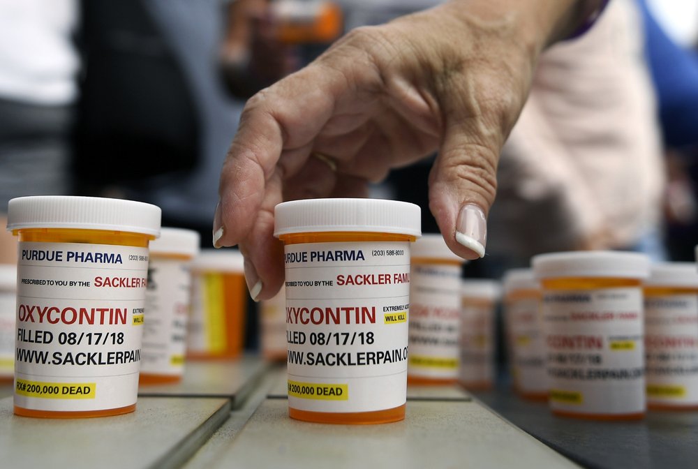 Big question in opioid suits: How to divide any settlement
