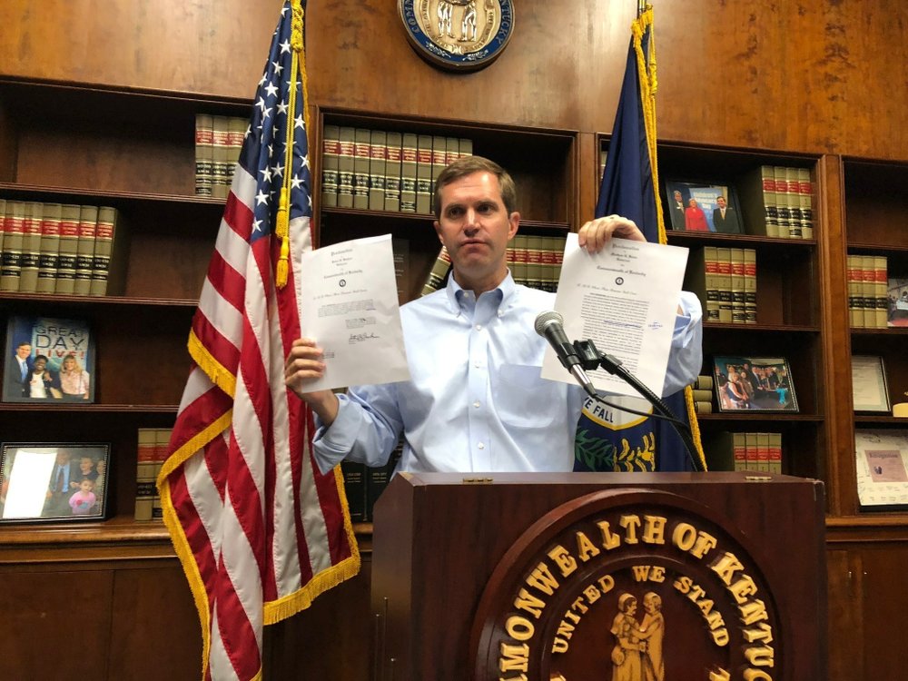 In this Saturday, July 20, 2019, file photo, Kentucky Attorney General Andy Beshear criticizes Gov. Matt Bevin's proclamation calling for a special session to fix state pension plans in Frankfort, Ky. Beshear, a Democrat, is running for governor against Bevin, the Republican incumbent. Beshear was critical of the wording of the proclamation. (AP Photo/Bruce Schreiner, File)