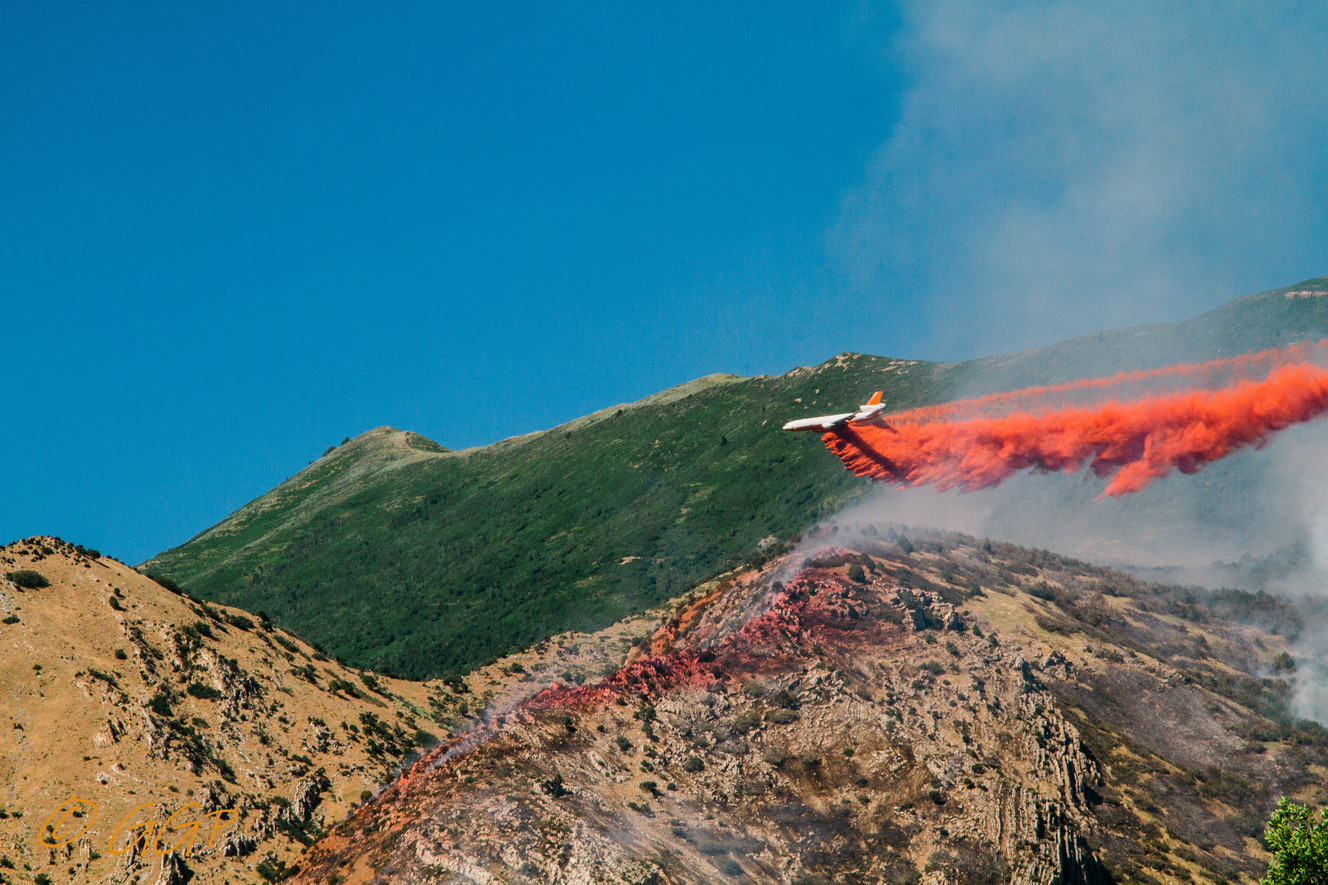 A large tanker drops its payload over the Round Peak Fire in Utah County on Tuesday, July 16, 2019. (Photo: Garrett Giles, iWitness)