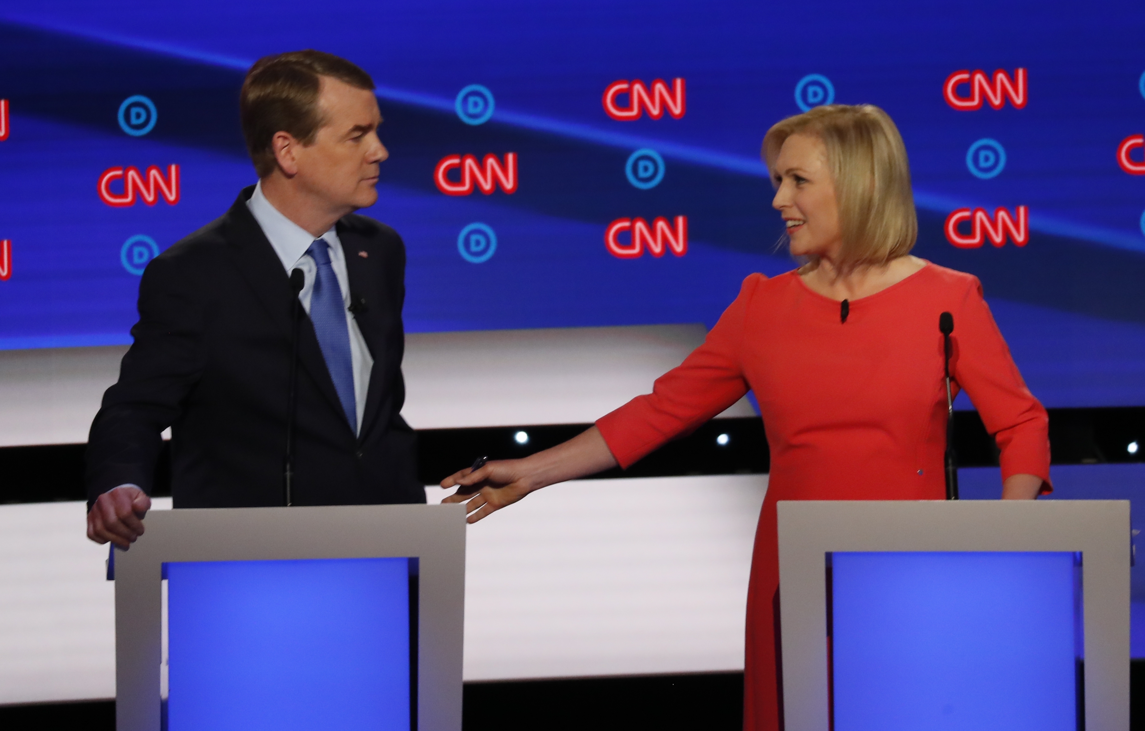 Sen. Kirsten Gillibrand, D-N.Y. gestures toward Sen. Michael Bennet, D-Colo., during the second of two Democratic presidential primary debates hosted by CNN Wednesday, July 31, 2019, in the Fox Theatre in Detroit. (AP Photo/Paul Sancya)