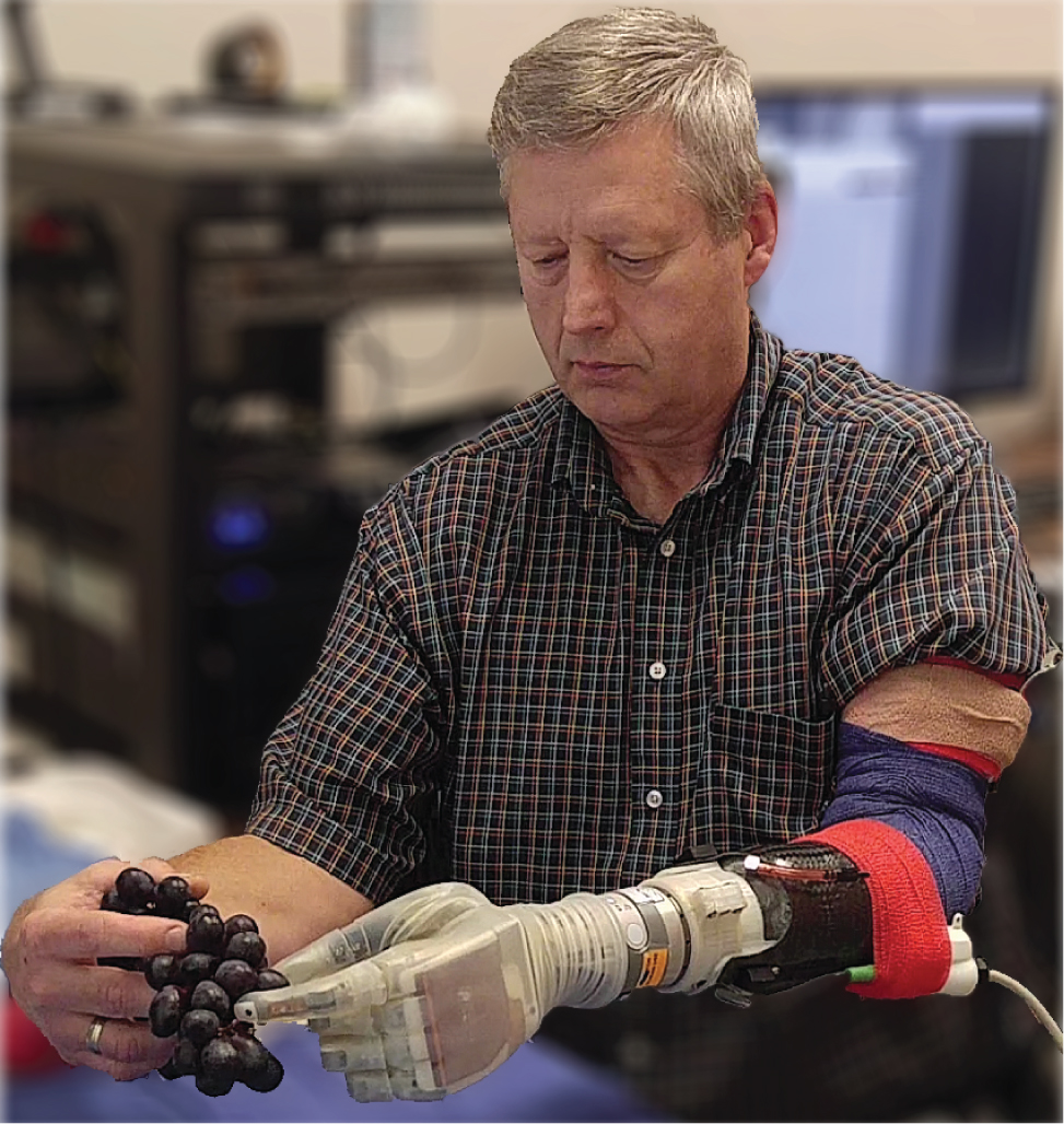 Kevin Walgamott with the Luke arm. (Photo: University of Utah Center for Neural Interfaces)