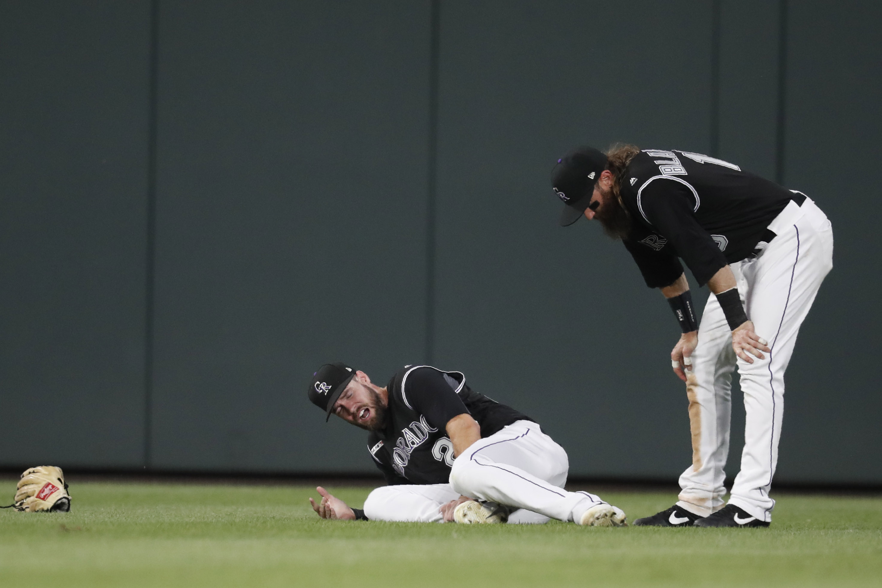 Dahl carted off after ankle injury, Rockies beat Giants 5-4