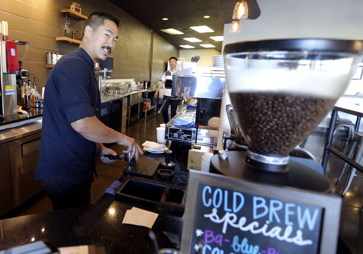 Eugene Kim, co-owner of The Bean Yard, prepares a coffee at the Sandy shop on Thursday, July 18, 2019. Kim's father, Chihan Kim initiated an ordinance to allow vertical farming in Murray, which the City Council passed. (Photo: Kristin Murphy, Deseret News)