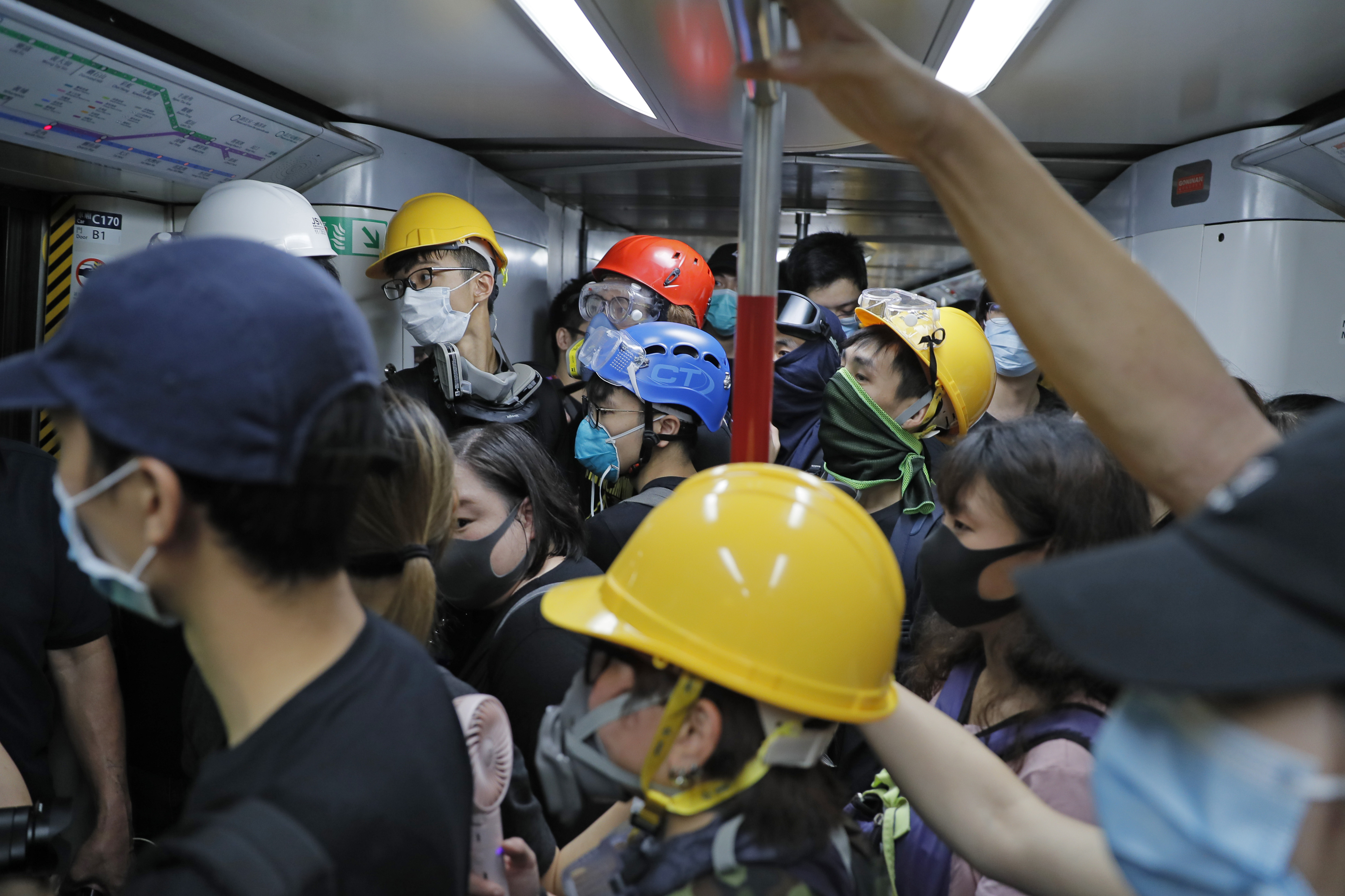 The Latest: Protesters besiege Hong Kong police HQ