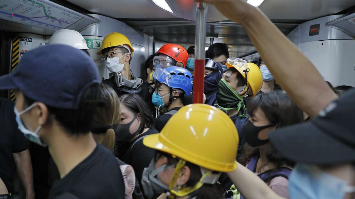 The Latest: Protesters besiege Hong Kong police HQ