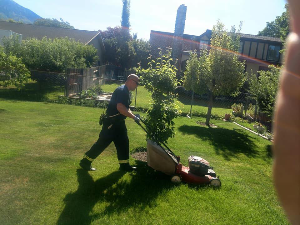 Firefighters in Orem stopped to help an older woman finish mowing her lawn. She told them she had been praying for help when they approached her and offered to take over. (Photo: Orem Fire Department, Facebook)