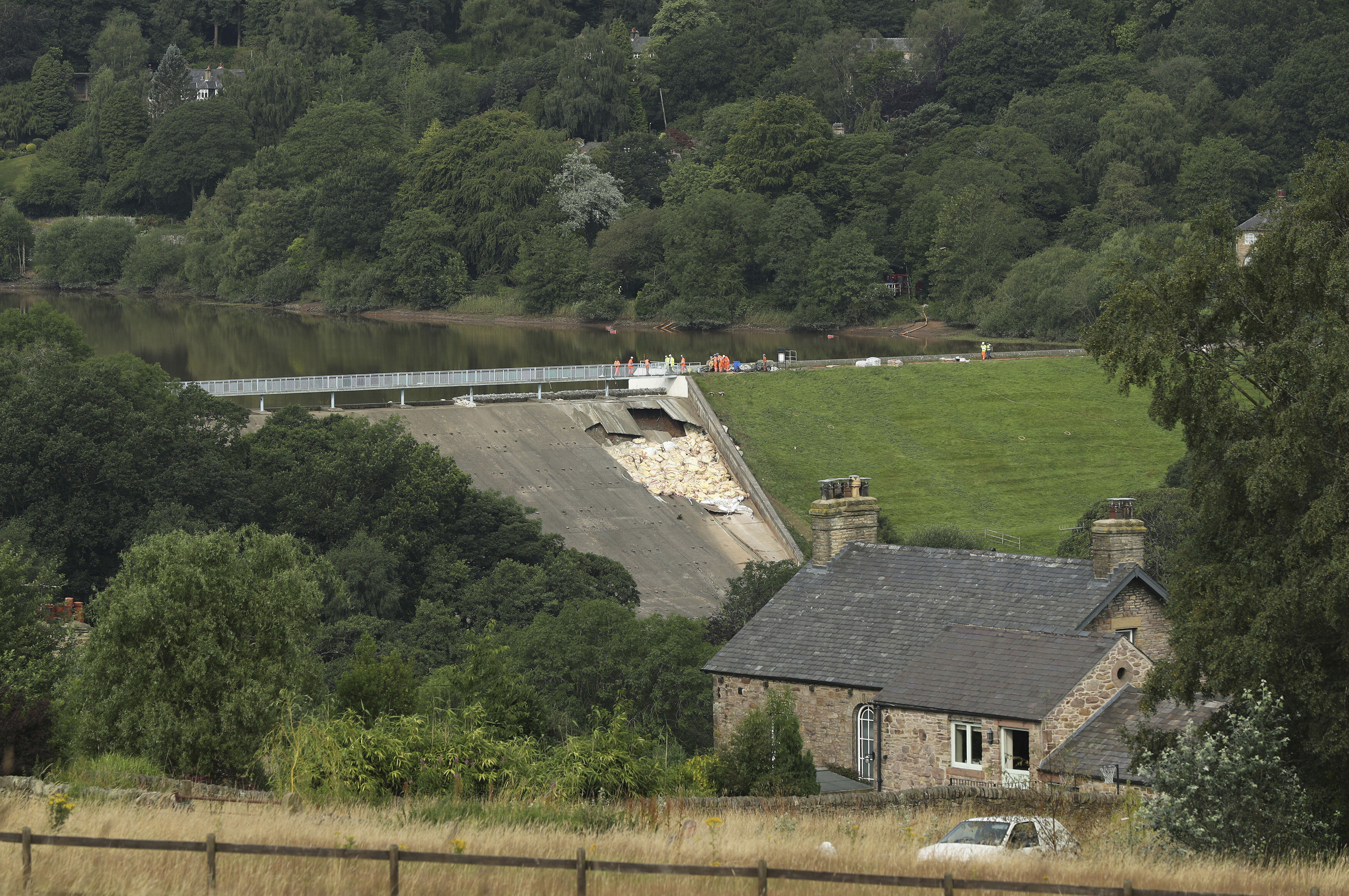 Town residents let back into homes below damaged England dam