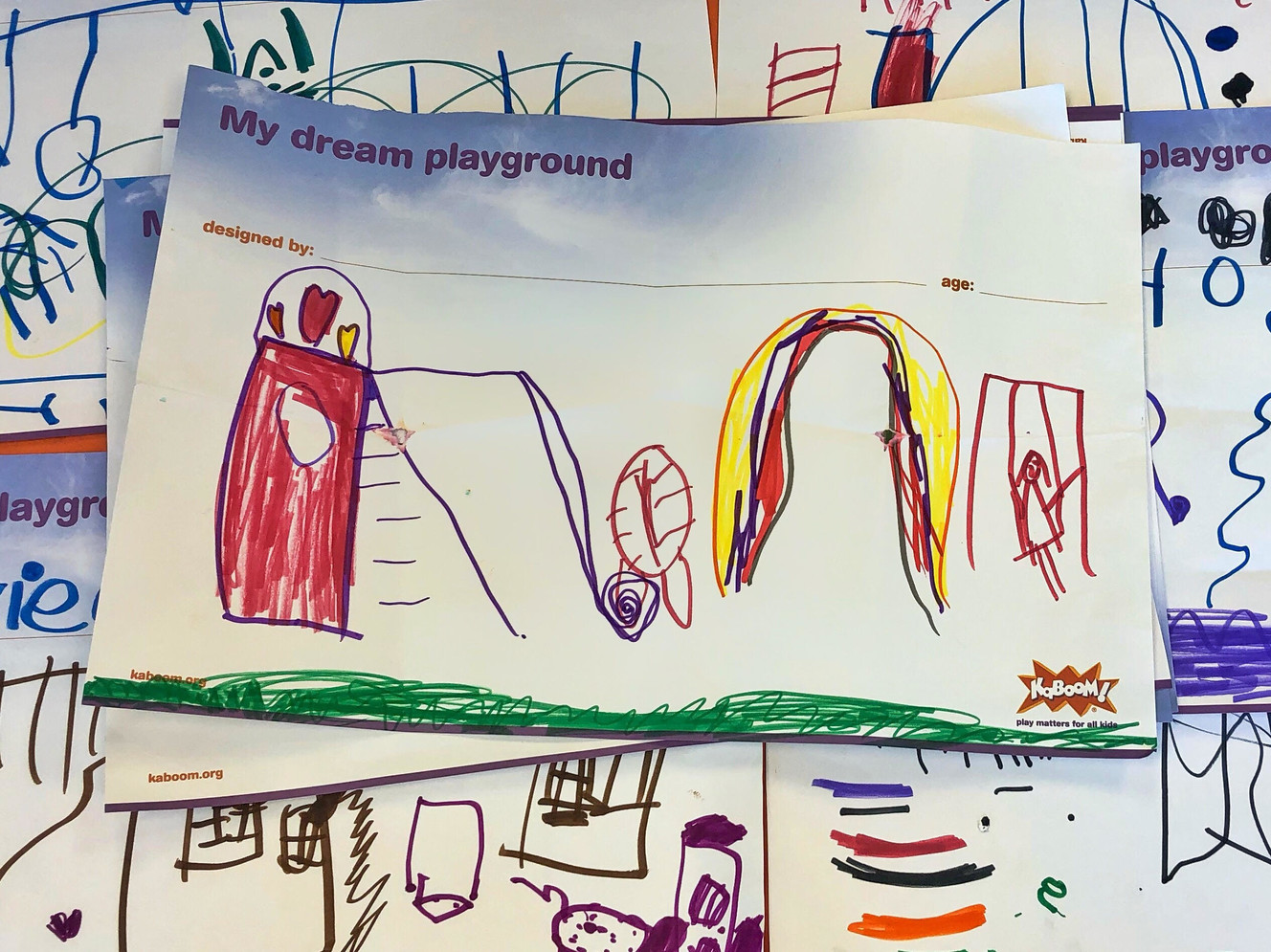 Local children and children from Utah Community Action's Head Start program, gathered to draw their "dream playground" on Tuesday, June 11, 2019, in South Salt Lake. The drawings were used to build a playground at Ray and Tye Noorda Utah Community Action Center. (Photo: Courtesy of Utah Community Action)