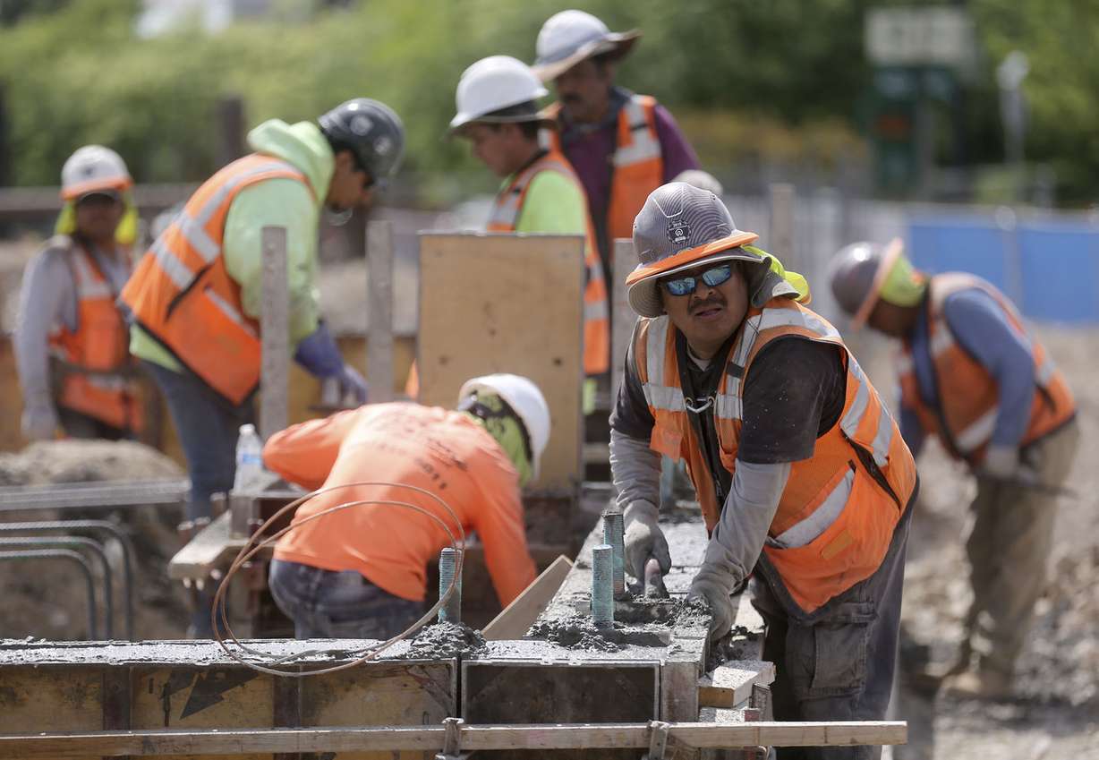 Nicholas Sarabria and other construction workers build a student housing complex next to Utah Valley University in Orem on Wednesday, July 17, 2019. (Photo: Kristin Murphy, KSL)