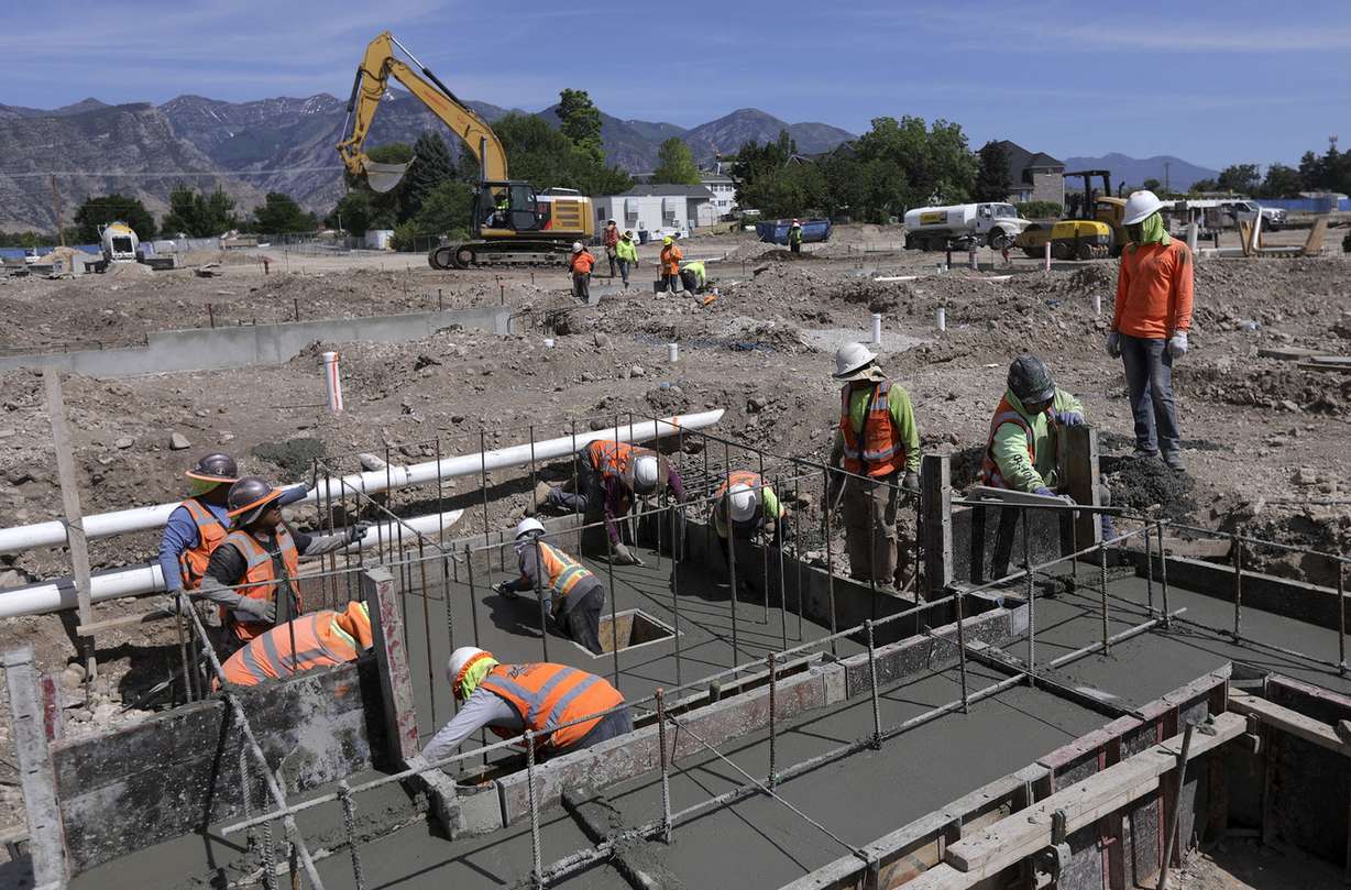 Construction workers build a student housing complex next to Utah Valley University in Orem on Wednesday, July 17, 2019. (Photo: Kristin Murphy, KSL)