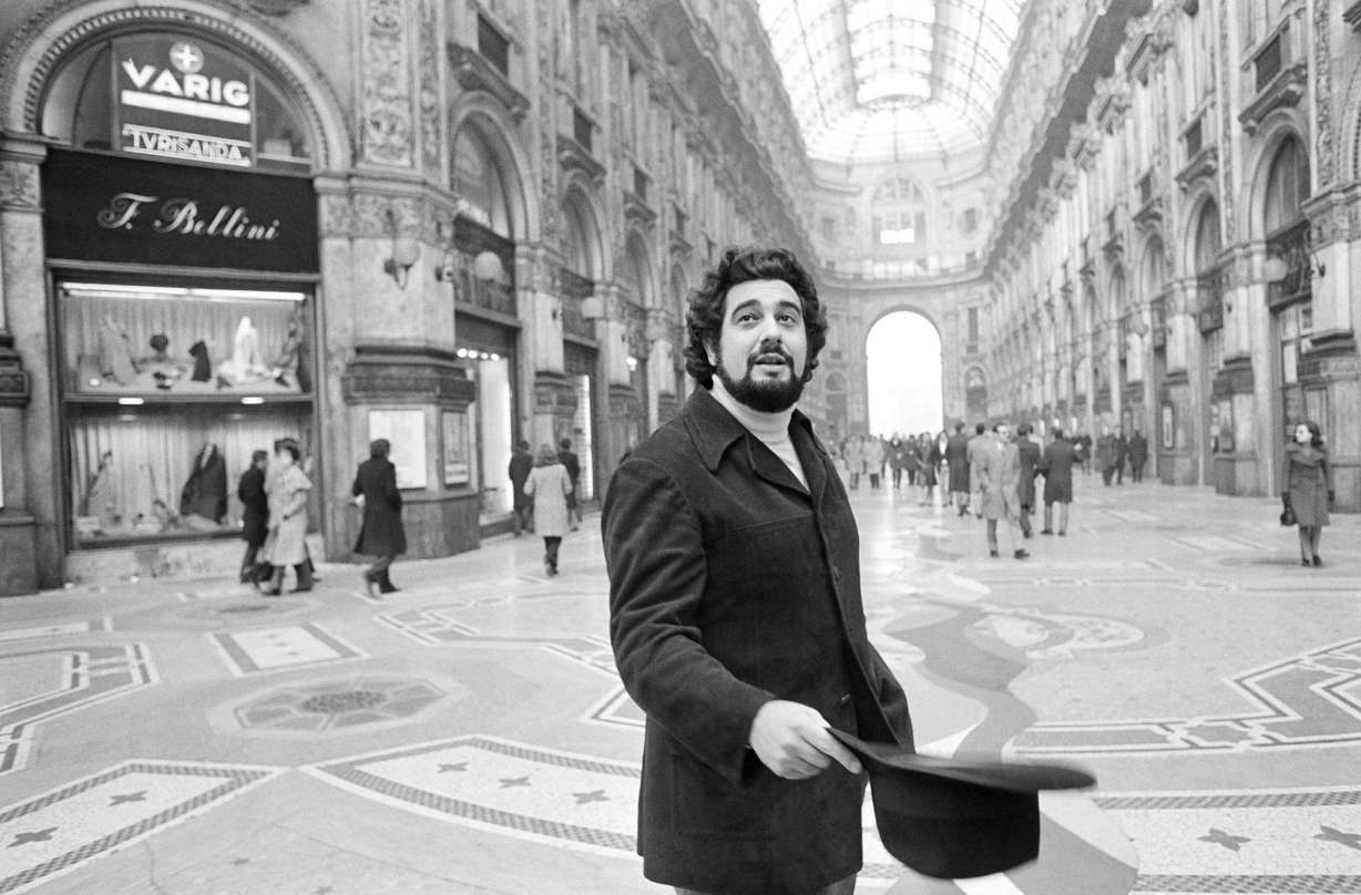FILE - In this Dec. 12, 1972, file photo, Placido Domingo, who inaugurated the season at La Scala, walks in the Piazza Scala with the Opera House in the background, in Milan. (Raoul Fornezza, AP Photo, File)
