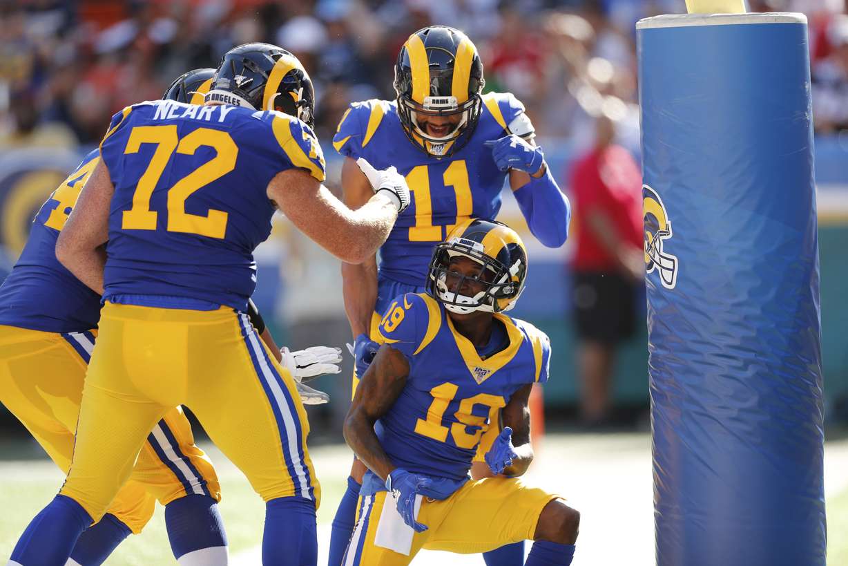 Los Angeles Rams wide receiver JoJo Natson (19) celebrates with center Aaron Neary (72), safety Taylor Rapp (24), and wide receiver KhaDarel Hodge (11) after making a touchdown during the first half of a preseason NFL football game against the Dallas Cowboys, Saturday, Aug. 17, 2019, in Honolulu. (AP Photo/Marco Garcia)