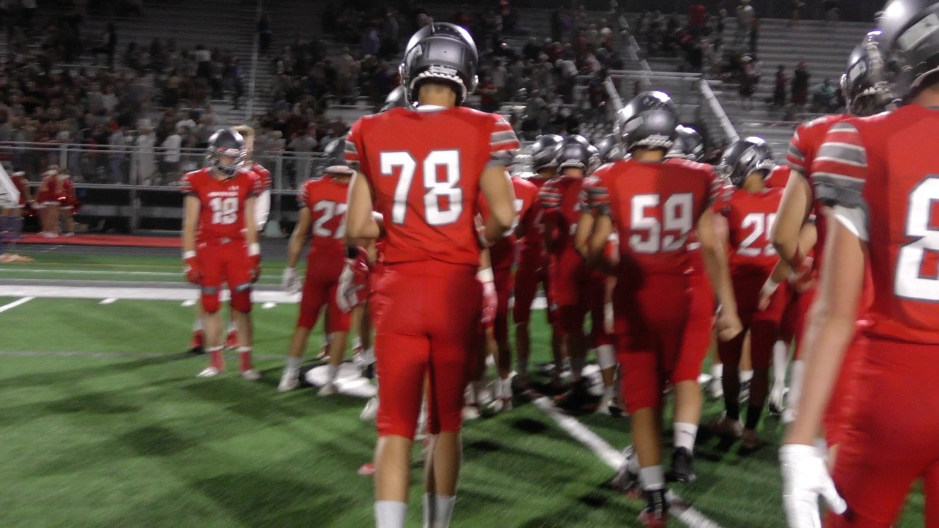 Mountain Ridge lineman Bryce Larsen, #78, joins his teammates in saluting the fans after the Sentinels' 56-0 loss to Olympus in the program's first-ever home game, Friday, Aug. 16, 2019 in Herriman. (Photo: Sean Walker, KSL.com)