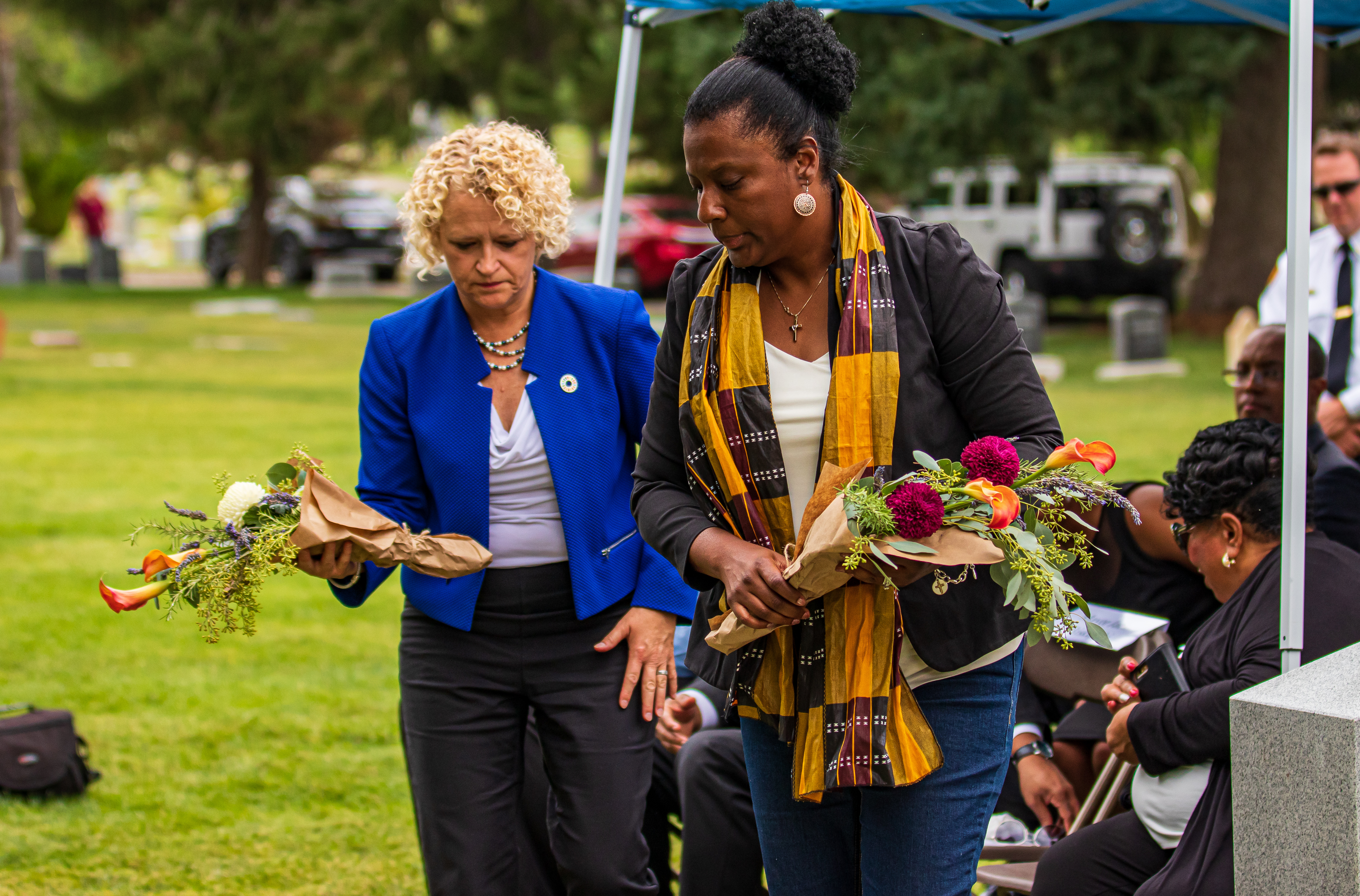 Salt Lake City Mayor Jackie Biskupski and Rep. Sandra Hollins lay flowers at Tom's headstone at Salt Lake City Cemetery on Thursday, Aug. 22, 2019. Tom was an enslaved pioneer who died in 1862 and was buried without a marker for 157 years. (Photo: Carter Williams, KSL.com)