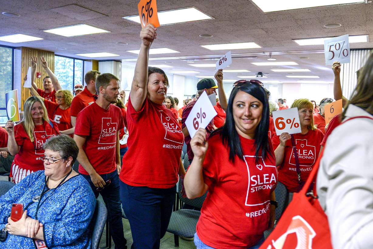 In this June 4, 2019 photo, teachers walk out of the public comment period at the Salt Lake City School District meeting regarding salary negotiations, in Salt Lake City. Photo: Leah Hogsten/The Salt Lake Tribune via AP