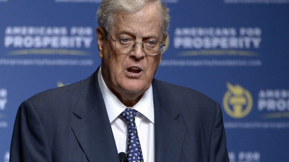 The Latest: Koch's twin: He was my best friend, despite suit