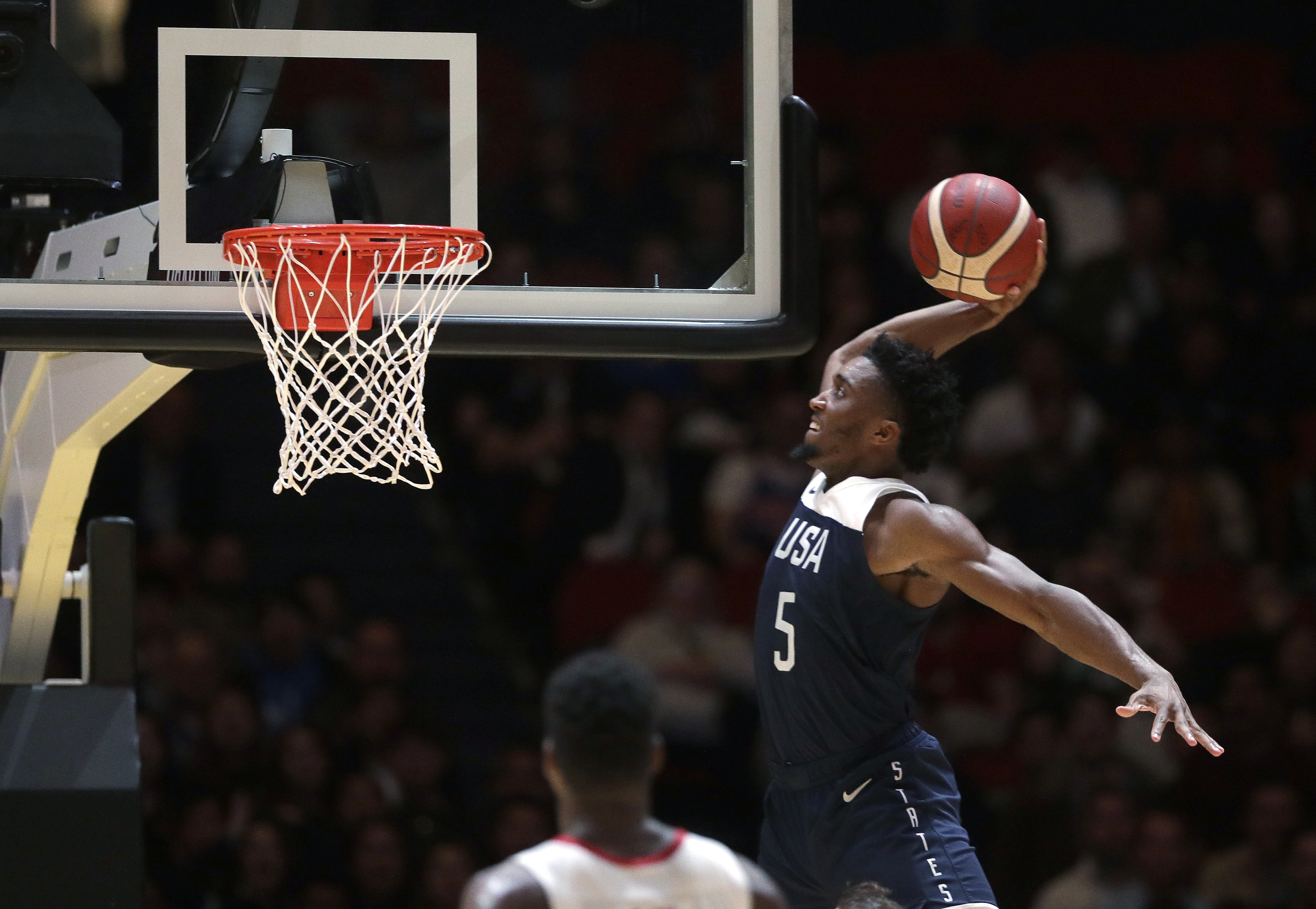 Donovan Mitchell goes up for a dunk for the United States. (Rick Rycroft, AP Photo)