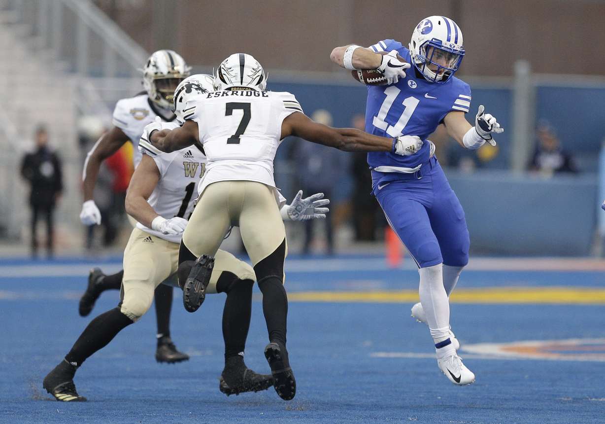 BYU defensive back Austin Lee (11) tries to get past Western Michigan's D'Wayne Eskridge (7) during an interception return in the second half of the Famous Idaho Potato Bowl NCAA college football game, Friday, Dec. 21, 2018, in Boise, Idaho. (Photo: Steve Conner, AP)