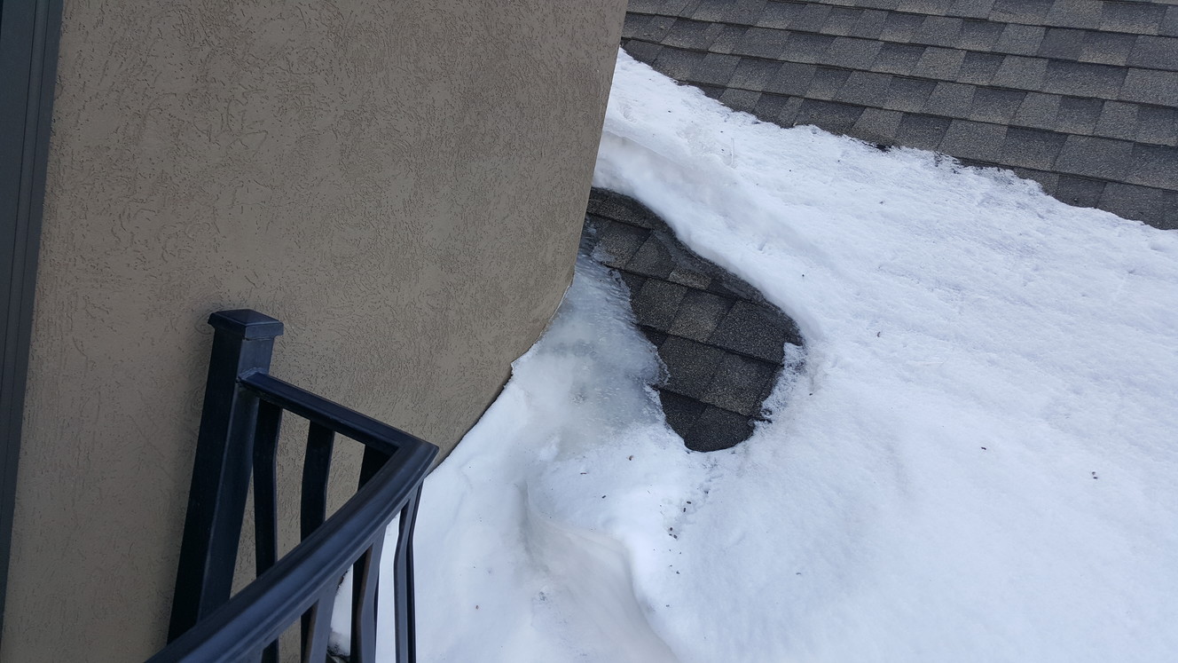 She'll be coming around the corner when she comes — but in this case, she's an ice dam. It leaks here every year, all winter long. (Photo: Garth Haslem, Crossroads Engineers & The Home Medic)