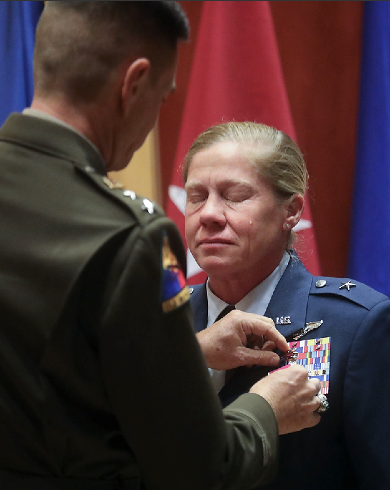 Maj. Gen. Jefferson S. Burton, adjutant general of the Utah National Guard, gives Utah Air National Guard Brig. Gen. Christine Burckle the Legion of Merit, one of the highest peacetime U.S. military decorations, during her retirement ceremony at the Roland R. Wright Air National Guard Base in Salt Lake City on Thursday, Aug. 29, 2019. (Kristin Murphy, KSL)