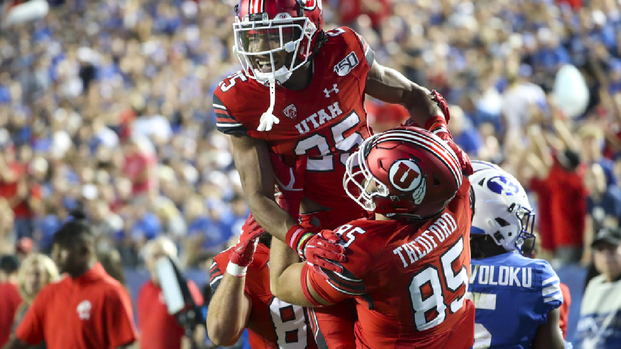 Pair of pick-sixes lead No. 14 Utah to 9th-straight win over rival BYU, 30-12