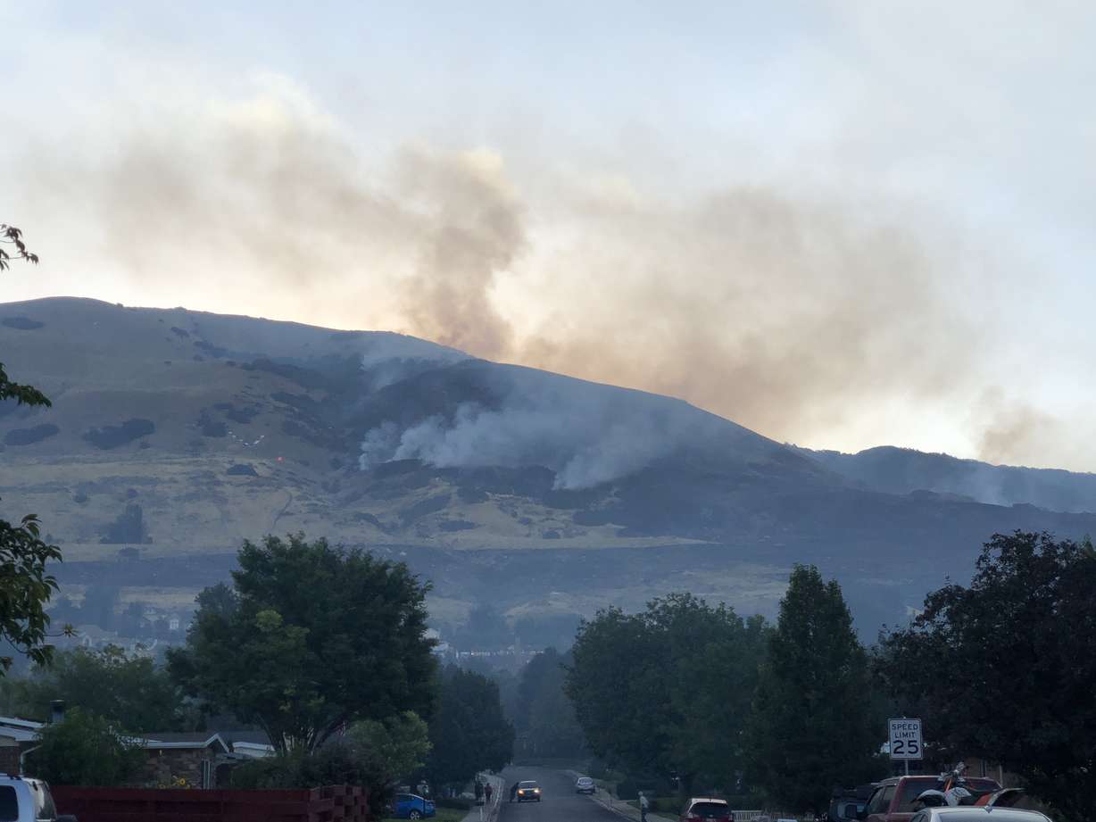 A thick haze filled the air as the sun rose above the mountains in Davis County after a devastating fire Friday, Aug. 30, 2019. (Photo: Jacob Klopfenstein, KSL.com)